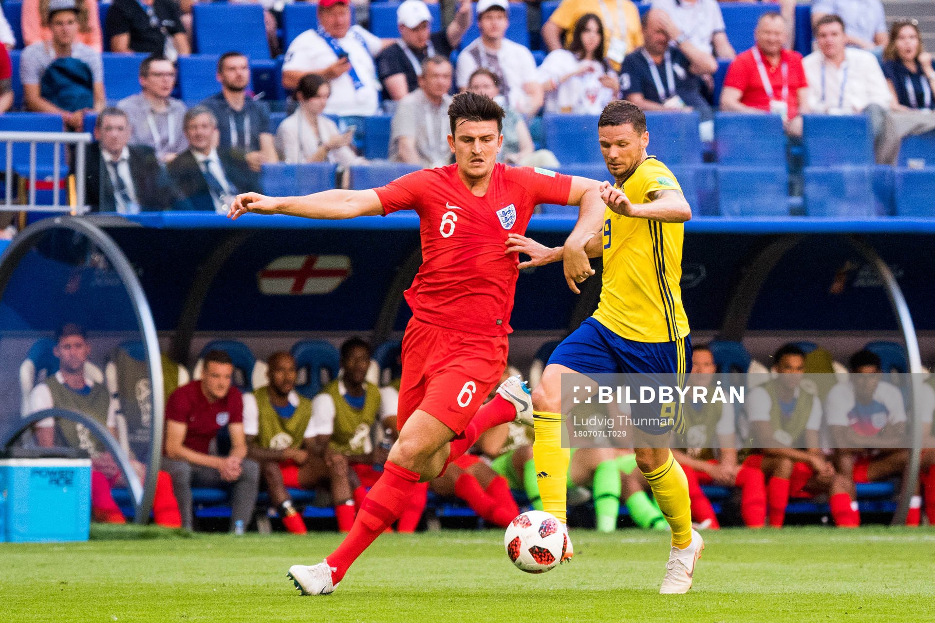 Harry Maguire of England and Marcus Berg of Sweden