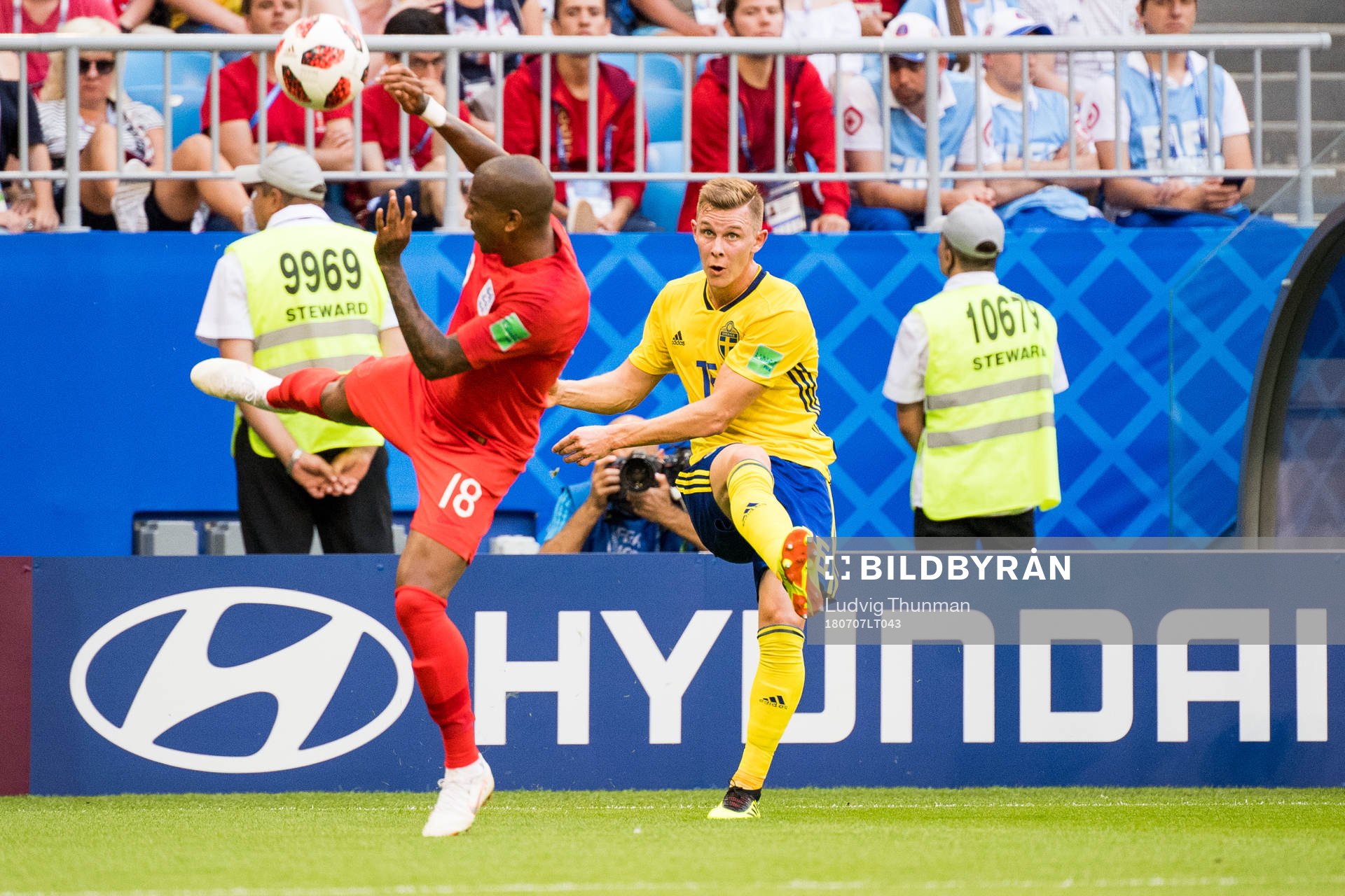 Ashley Young of England and Emil Krafth of Sweden