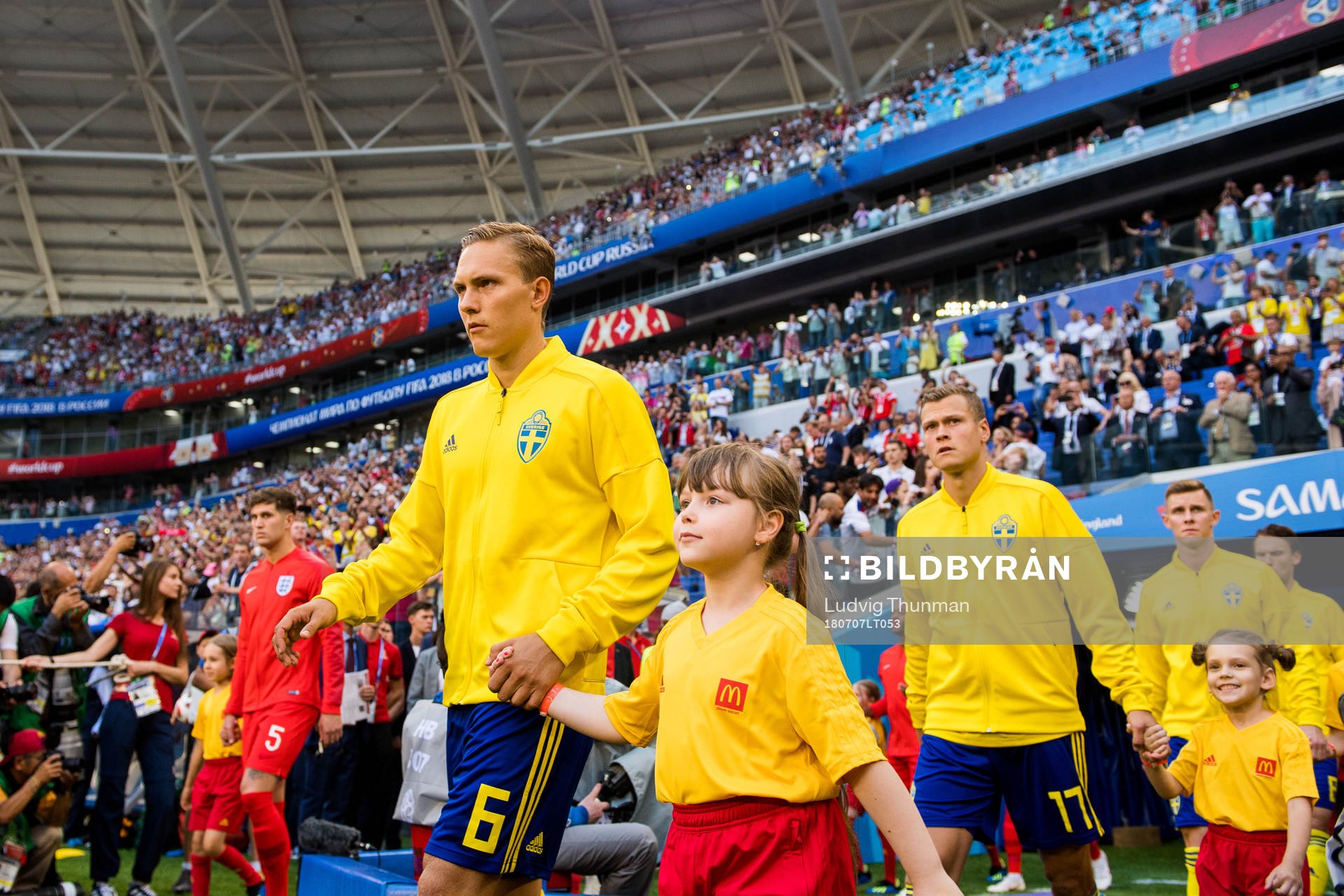 Ludwig Augustinsson and John Guidetti of Sweden enter the