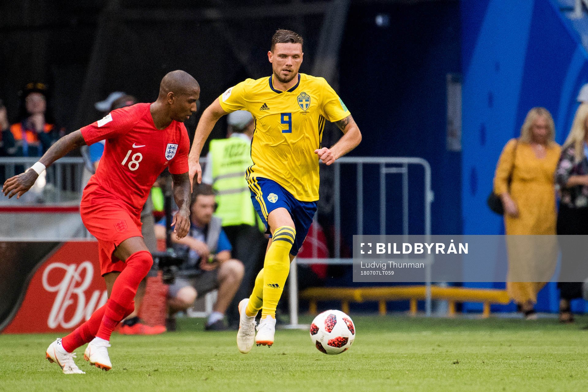 Ashley Young of England and Marcus Berg of Sweden