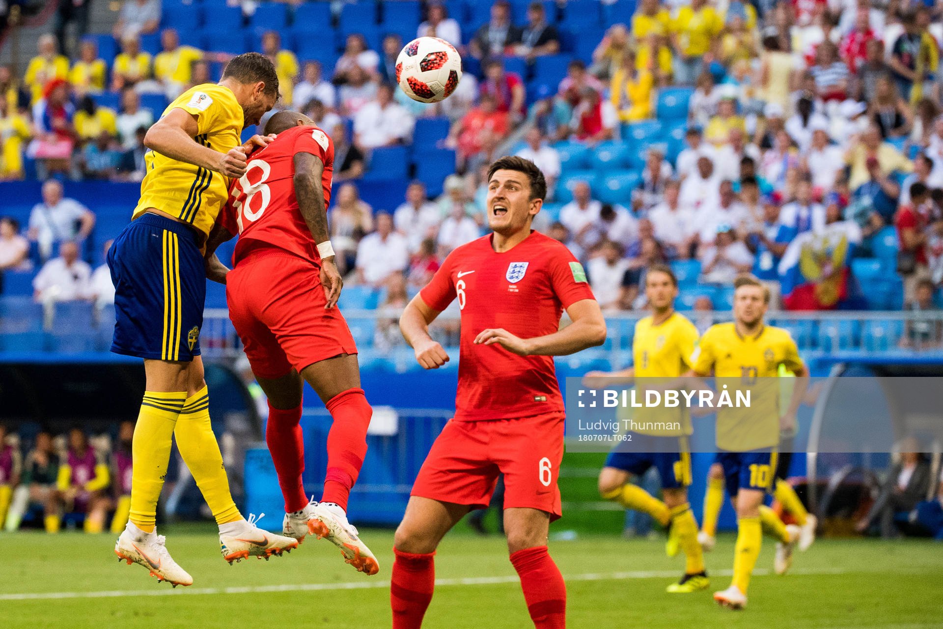 Marcus Berg of Sweden and Ashley Young of England