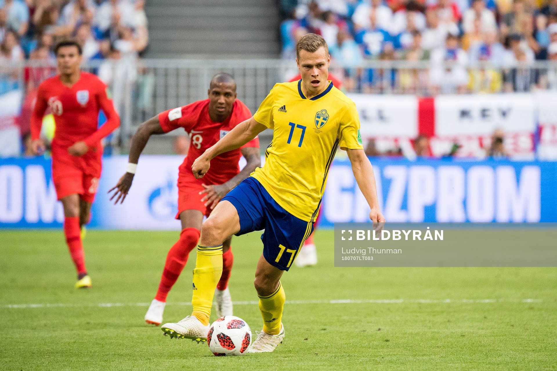 Ashley Young of England and Viktor Claesson of Sweden