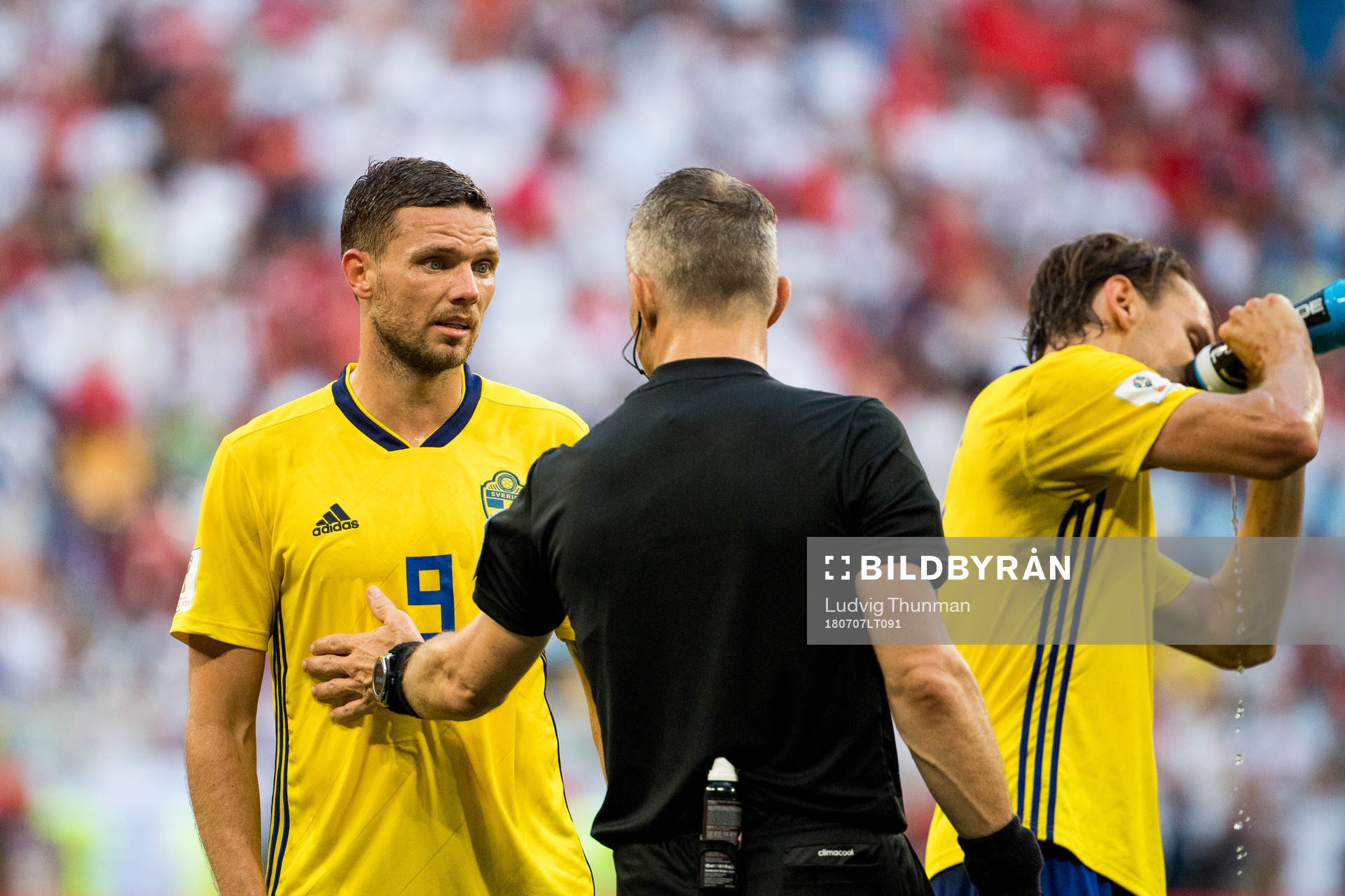 Marcus Berg of Sweden argues with the referee