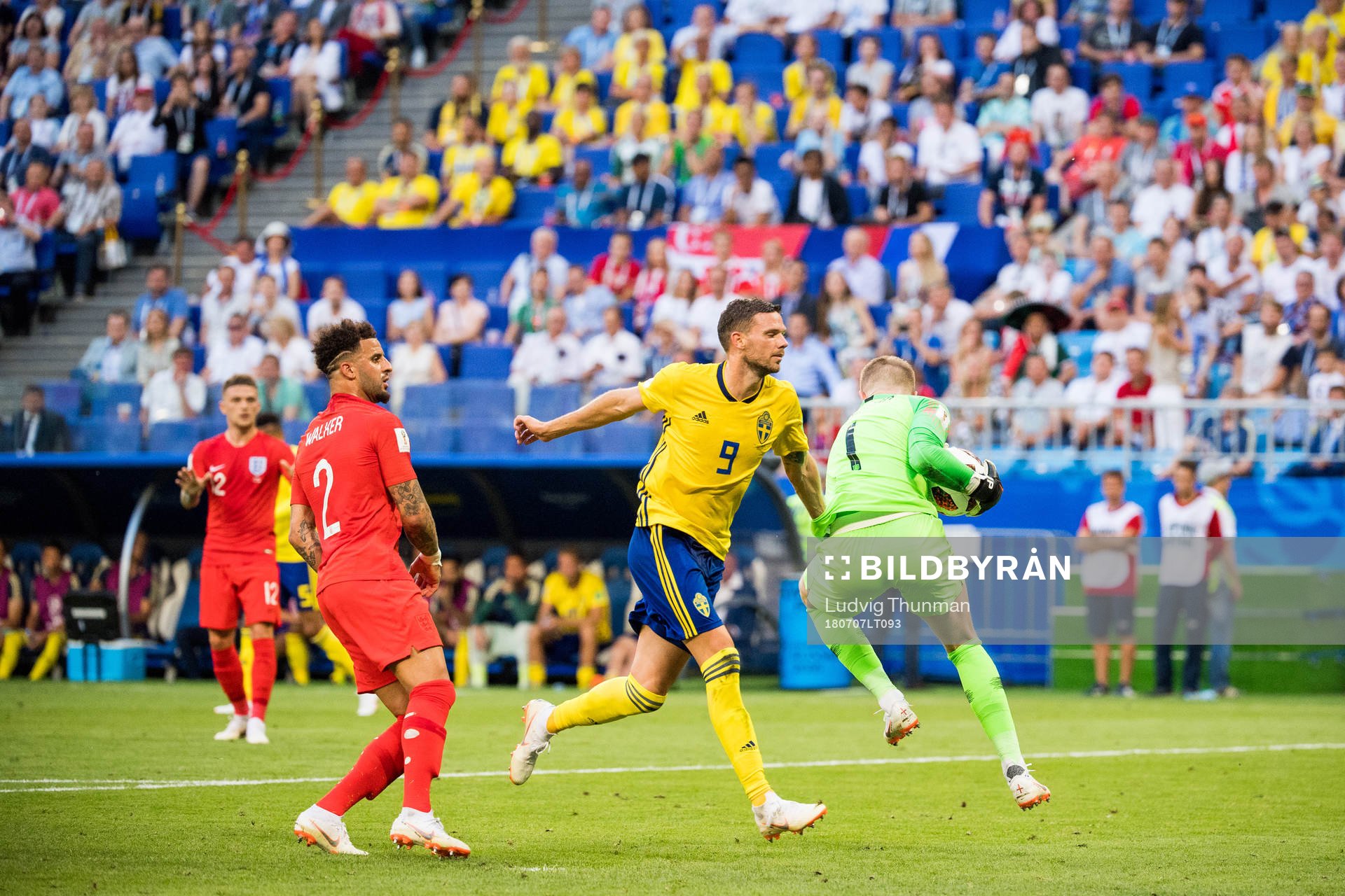 Marcus Berg of Sweden and goalkeeper Jordan Pickford of