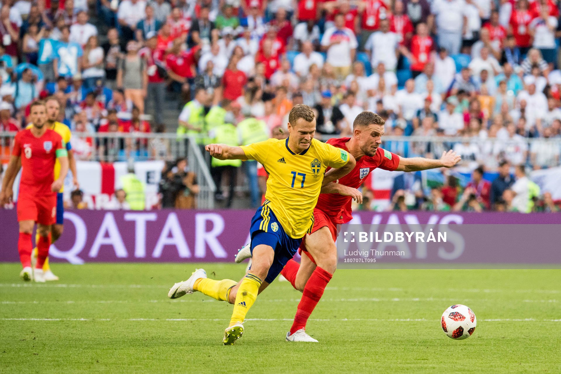 Viktor Claesson of Sweden and Jordan Henderson of England