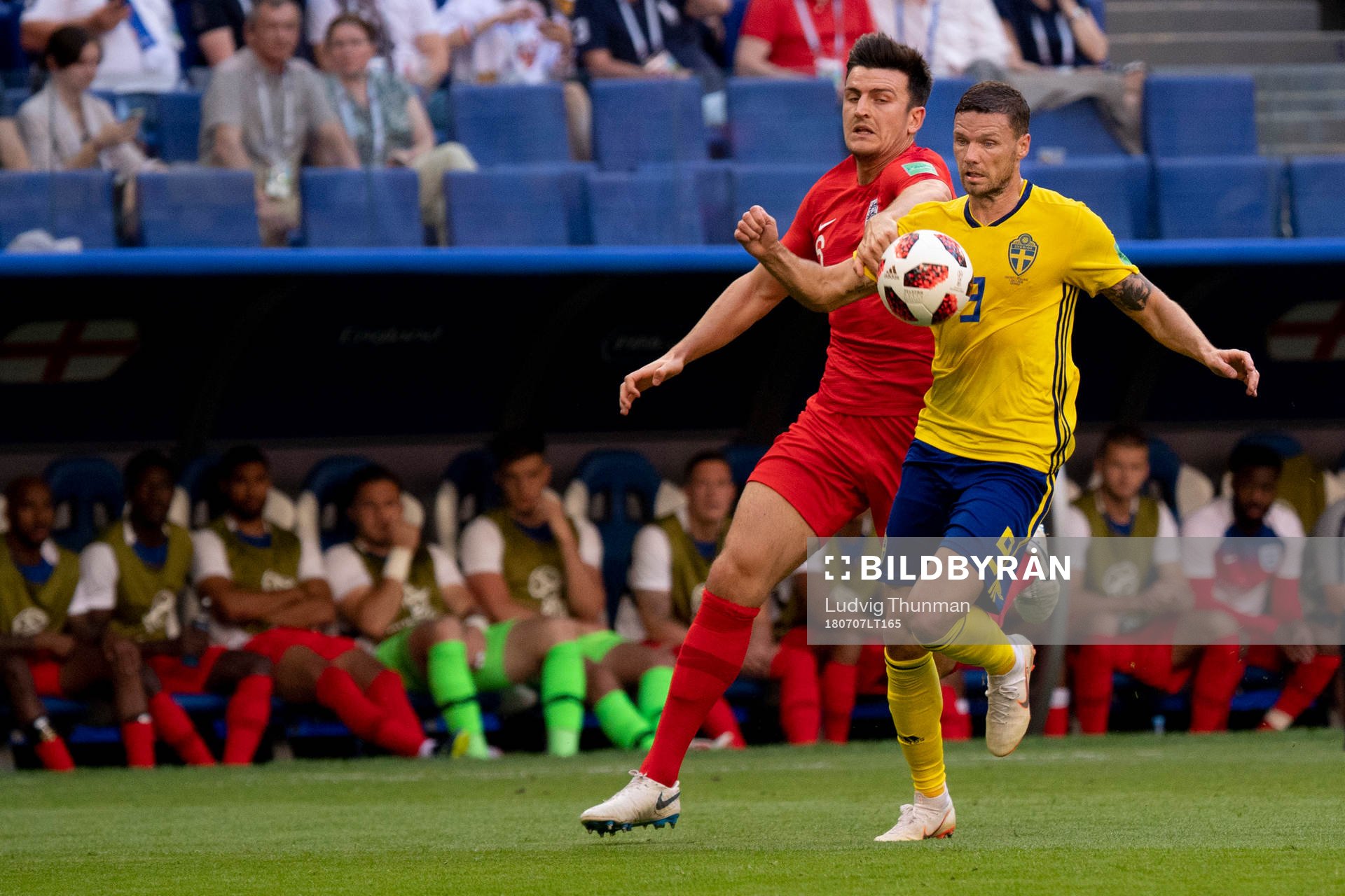 Harry Maguire of England and Marcus Berg of Sweden