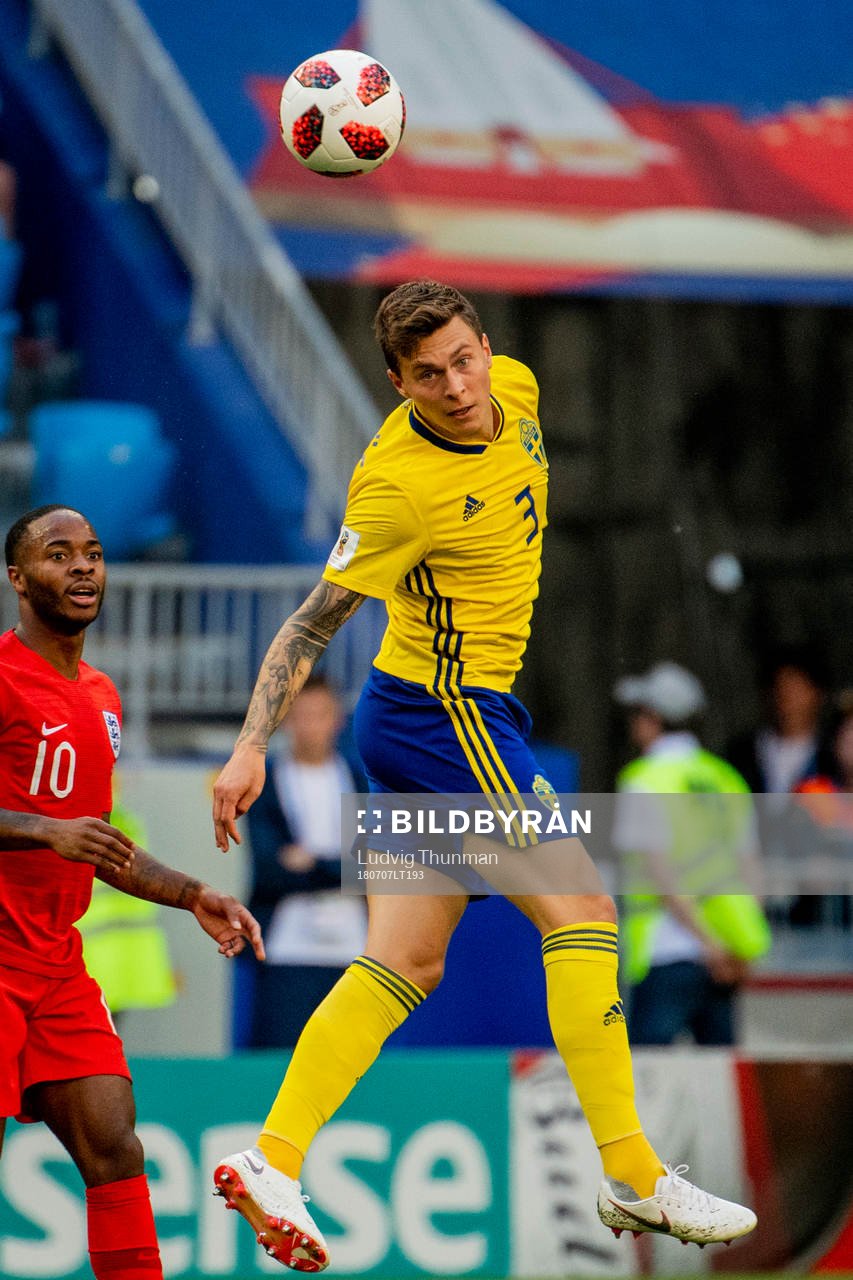 Raheem Sterling of England and Victor Nilsson Lindelöf of