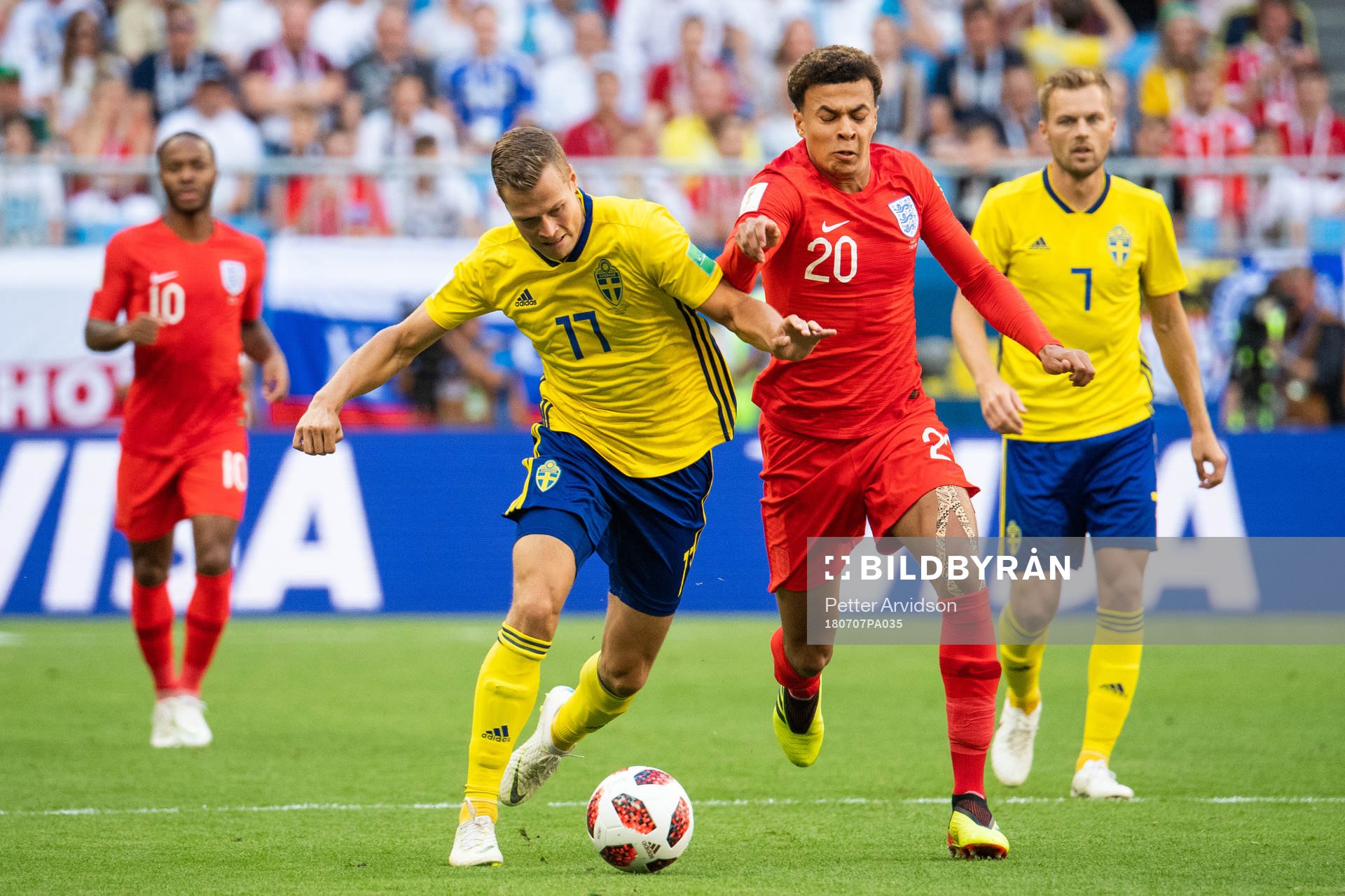 Viktor Claesson of Sweden competes for the ball with Dele