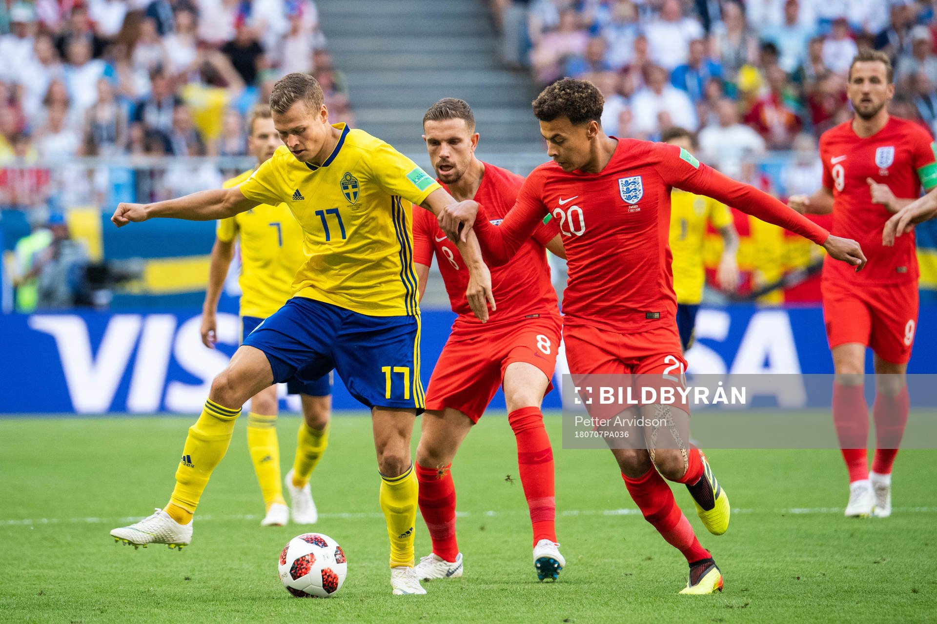 Viktor Claesson of Sweden competes for the ball with Dele
