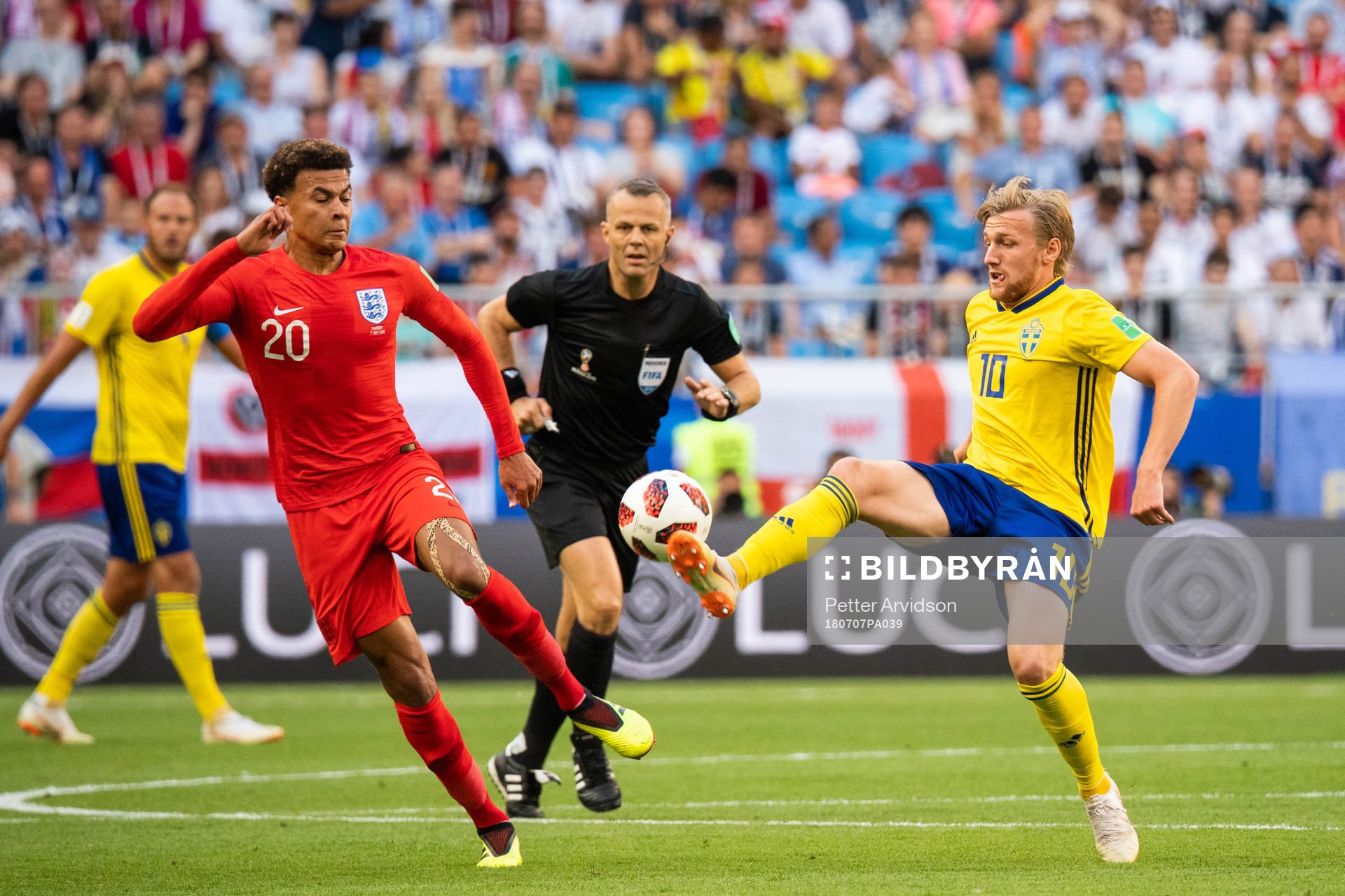 Dele Alli of England and Emil Forsberg of Sweden
