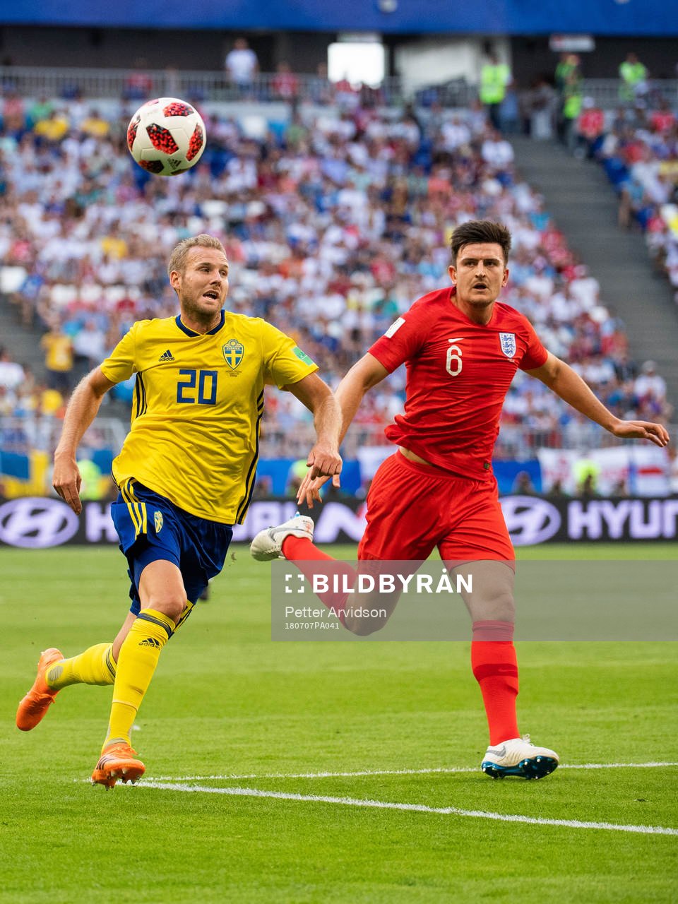 Ola Toivonen of Sweden competes for the ball with Harry