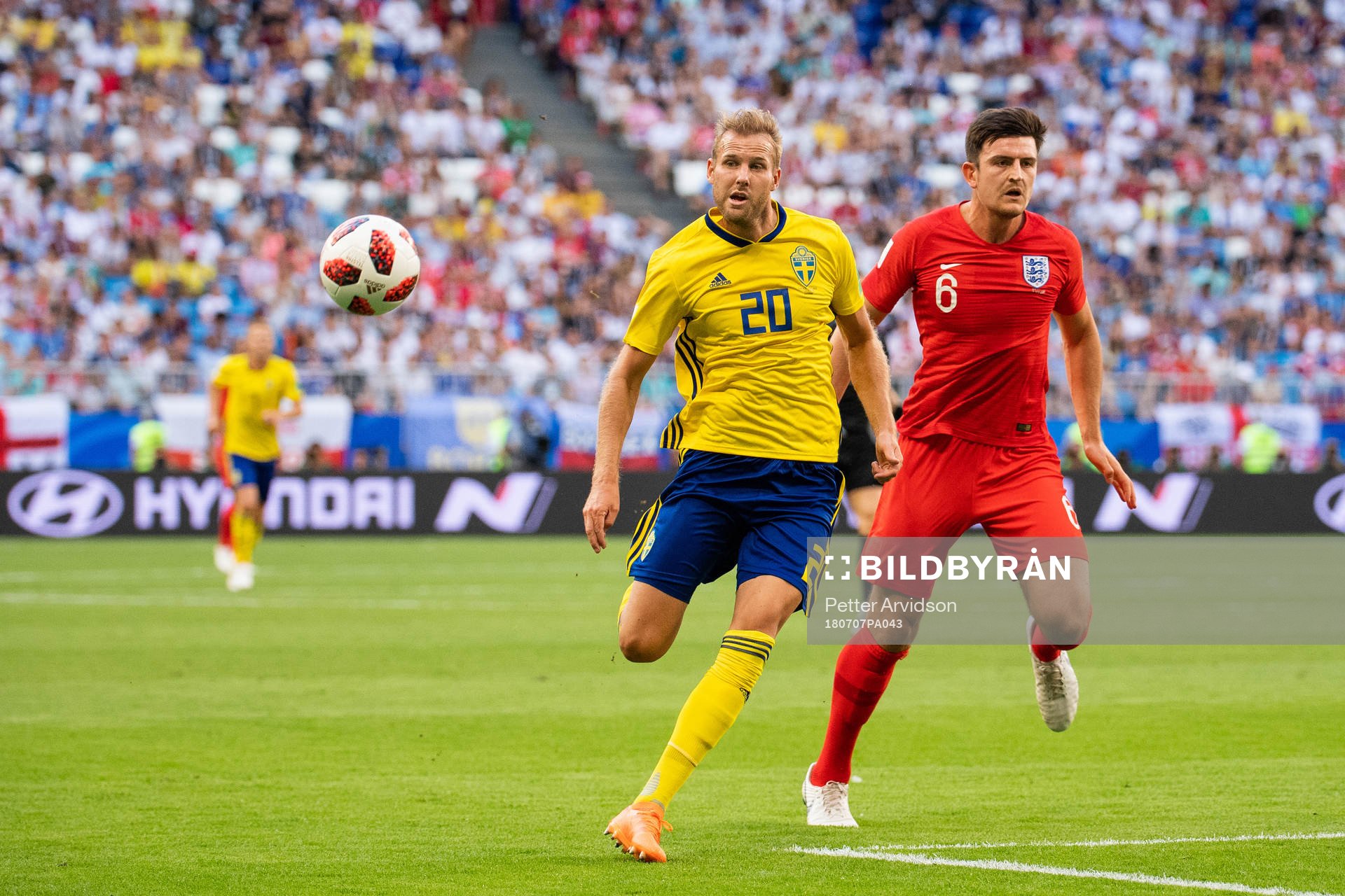 Ola Toivonen of Sweden competes for the ball with Harry