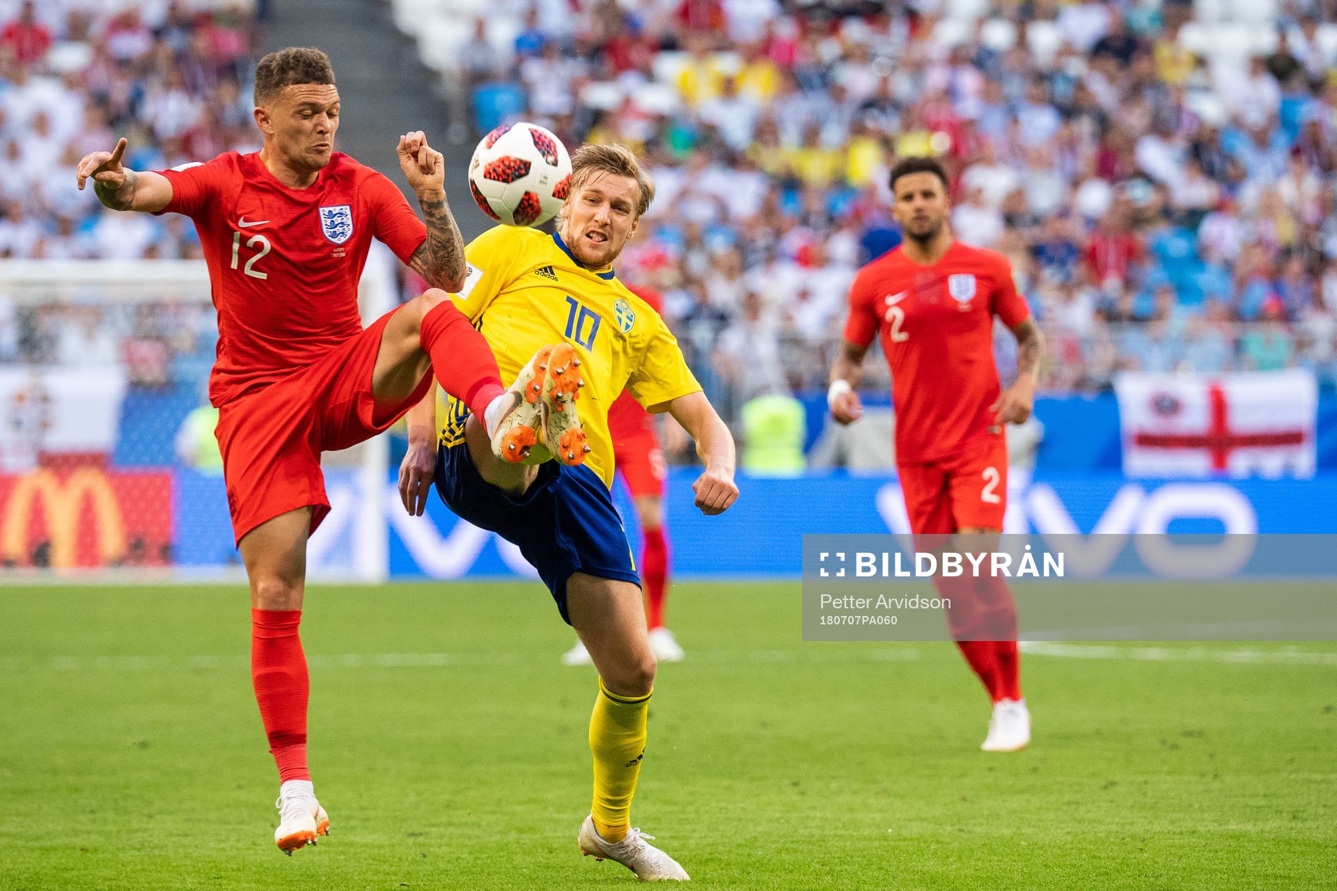 Kieran Trippier of England and Emil Forsberg of Sweden