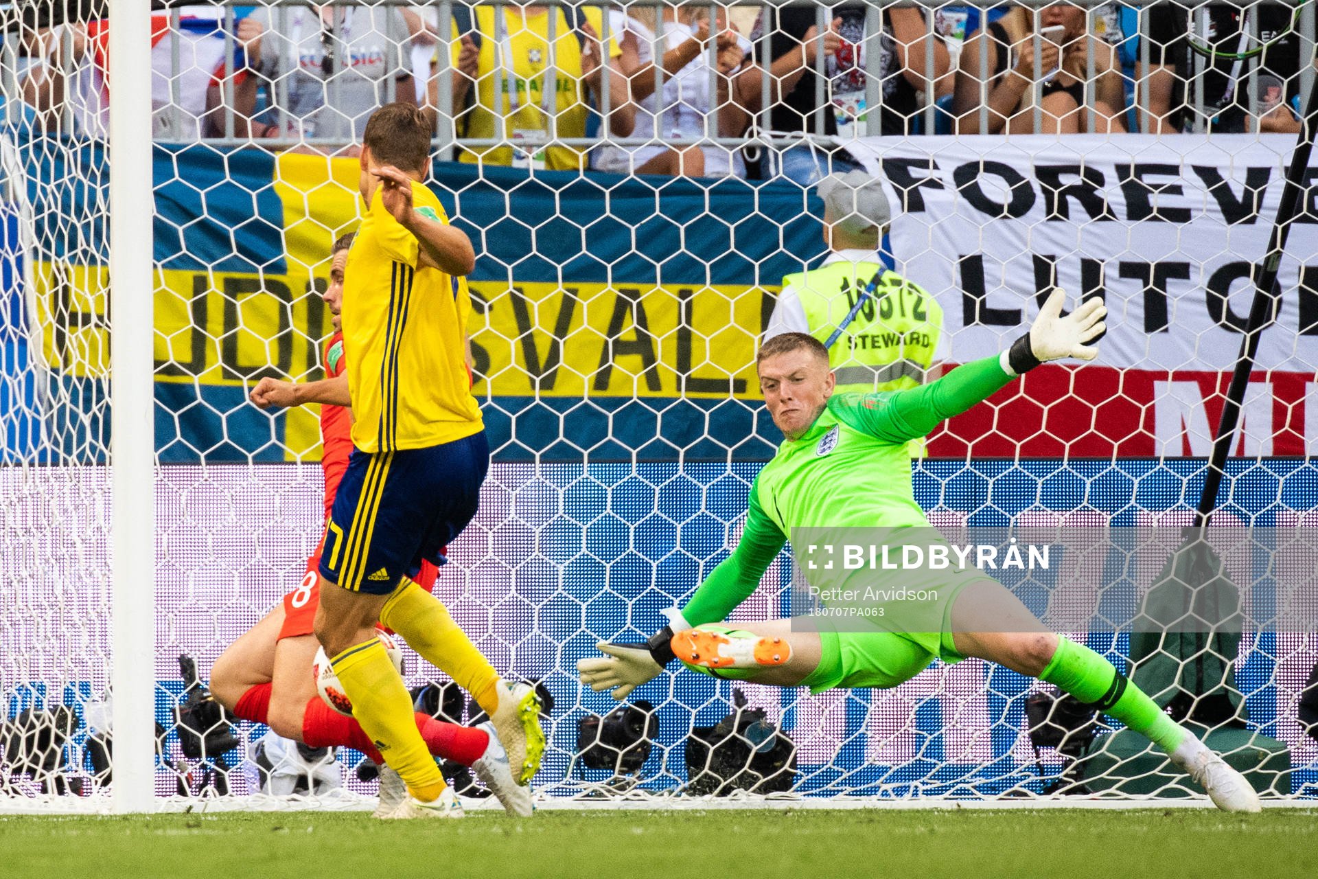 goalkeeper Jordan Pickford of England saves an attempt from