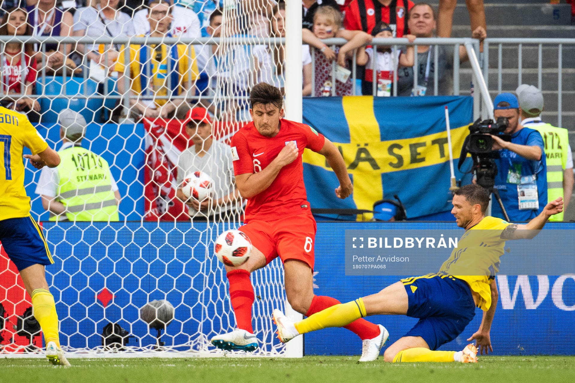Harry Maguire of England defends against Marcus Berg of