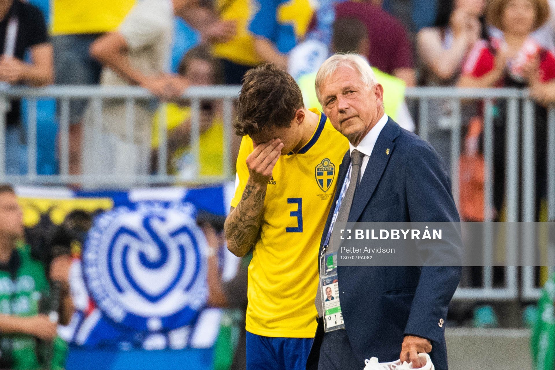 Team Manager Lars Richt hugs Victor Nilsson Lindelöf of Sweden who looks dejected after loosing during the FIFA World Cup quarter final match between Sweden and England on July 7, 2018 in Samara.