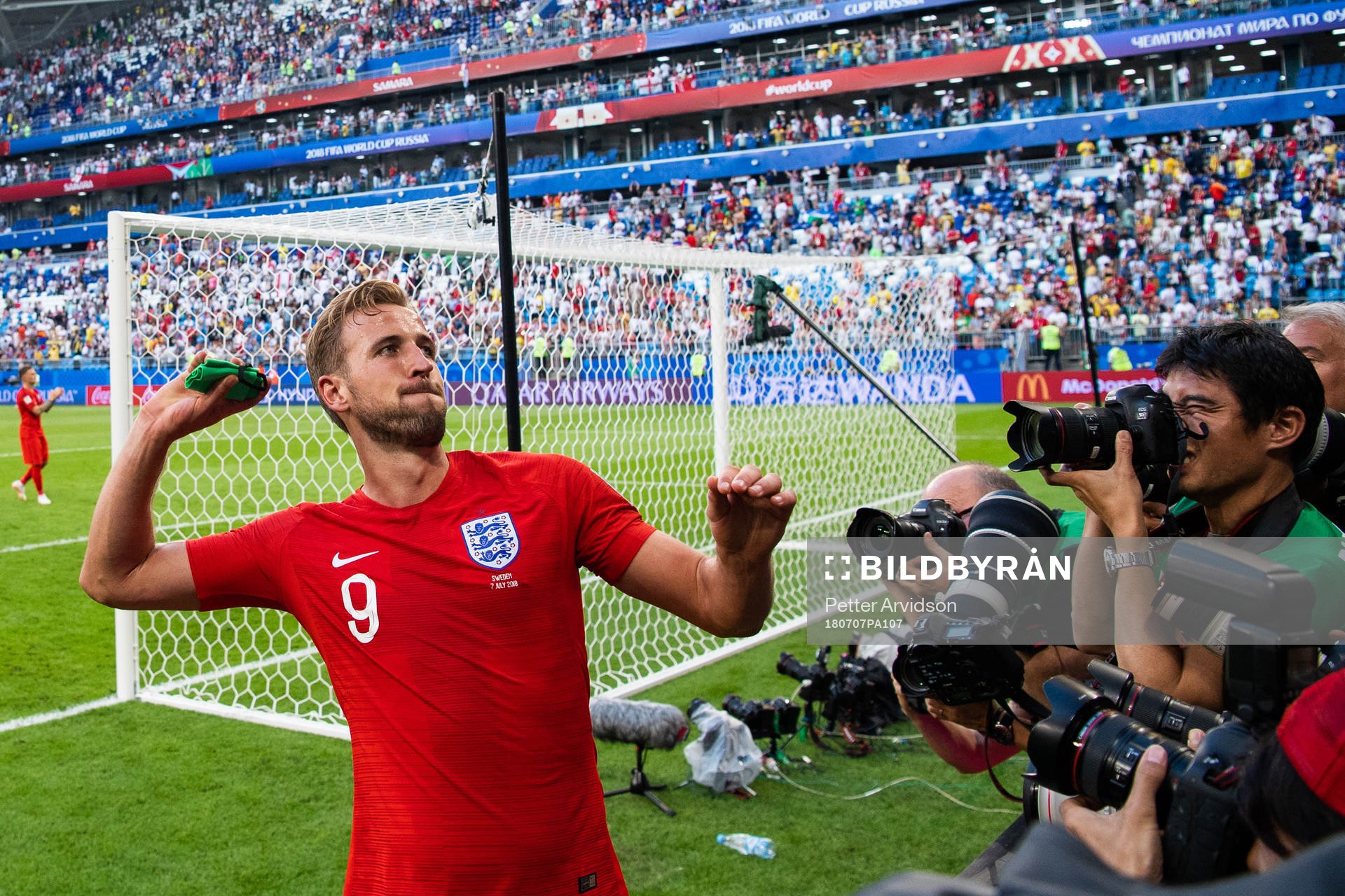 Harry Kane of England throws his captain arm band when he