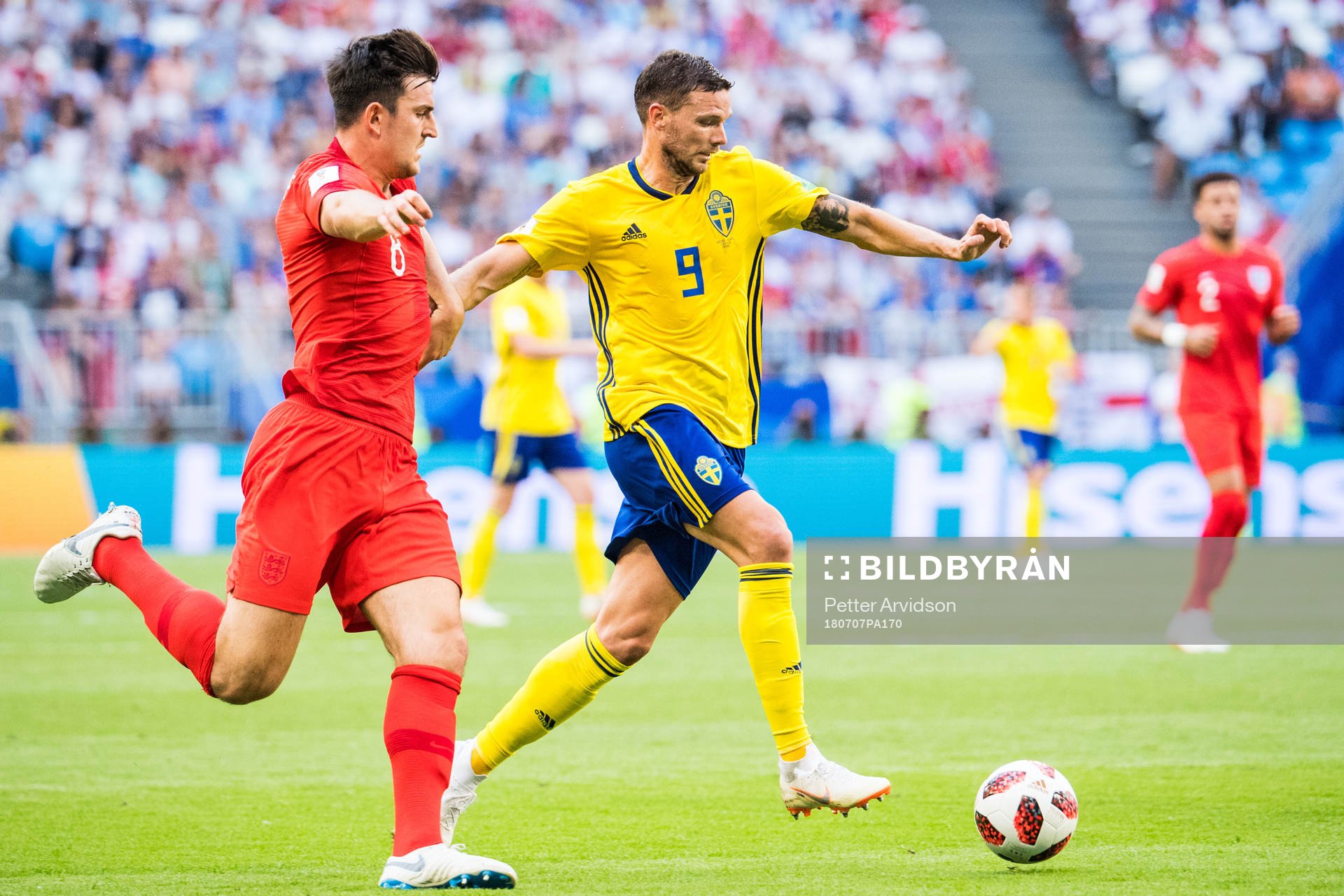 Marcus Berg of Sweden and Jordan Henderson of England
