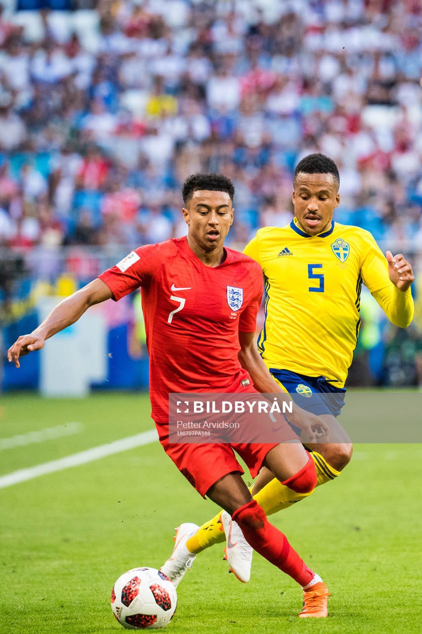 Jesse Lingard of England and Martin Olsson of Sweden