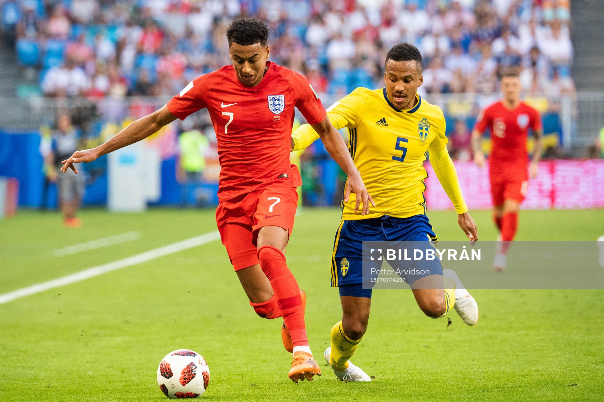 Jesse Lingard of England and Martin Olsson of Sweden