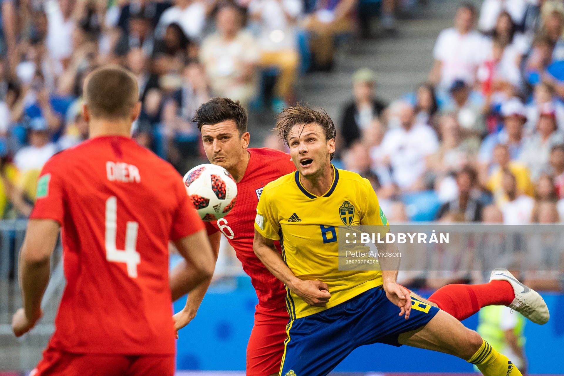 Harry Maguire of England and Albin Ekdal of Sweden competes