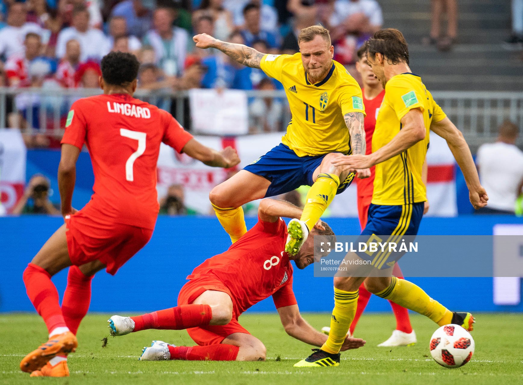 Jordan Henderson of England and John Guidetti of Sweden