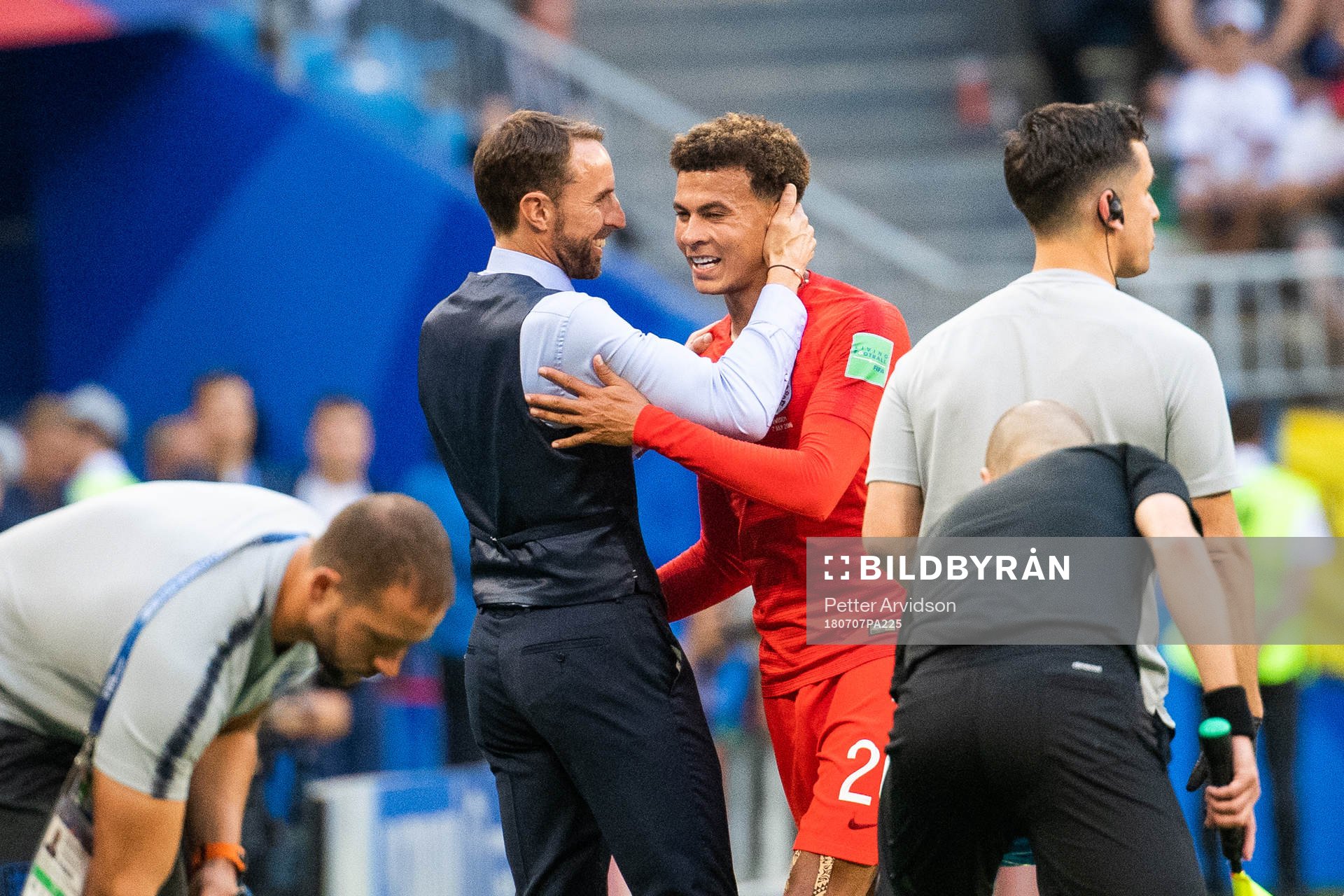 head coach Gareth Southgate celebrates with Dele Alli as he
