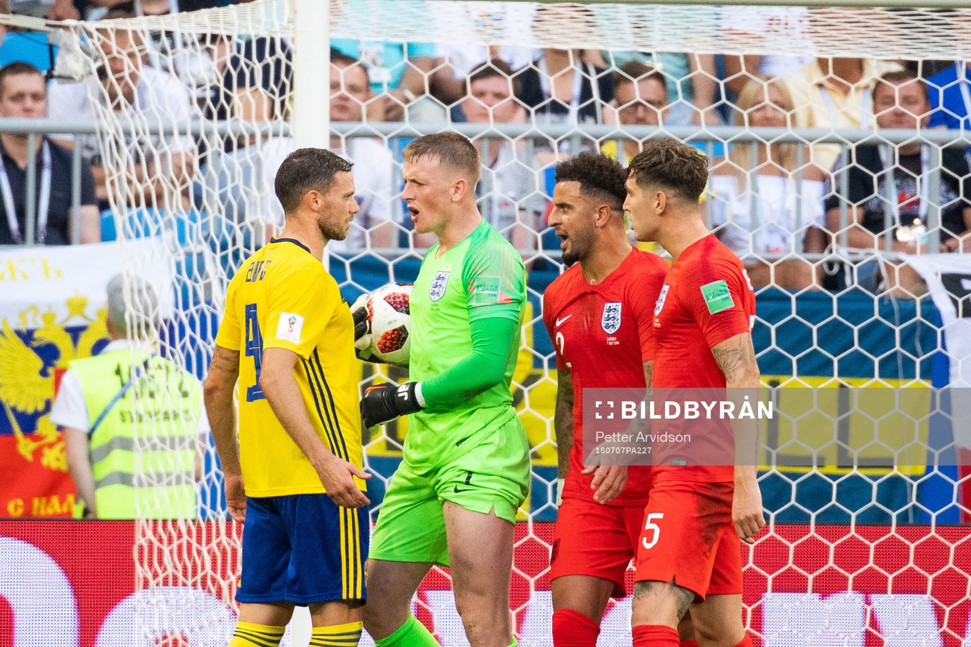 goalkeeper Jordan Pickford of England and Marcus Berg of