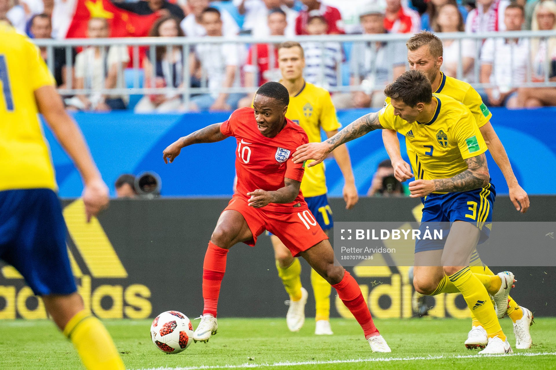 Raheem Sterling of England and Victor Nilsson Lindelöf of