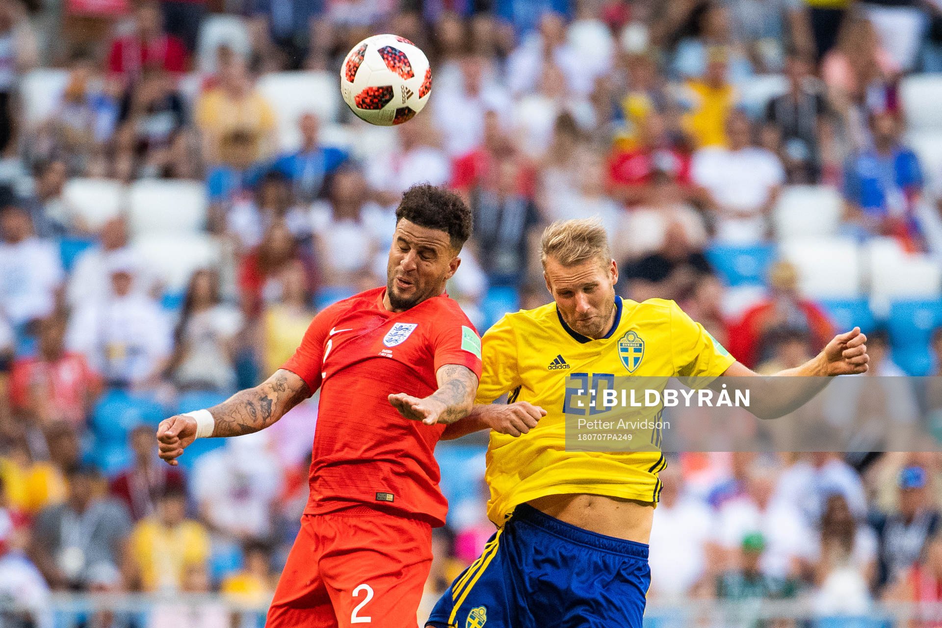 Kyle Walker of England competes for the ball with Ola
