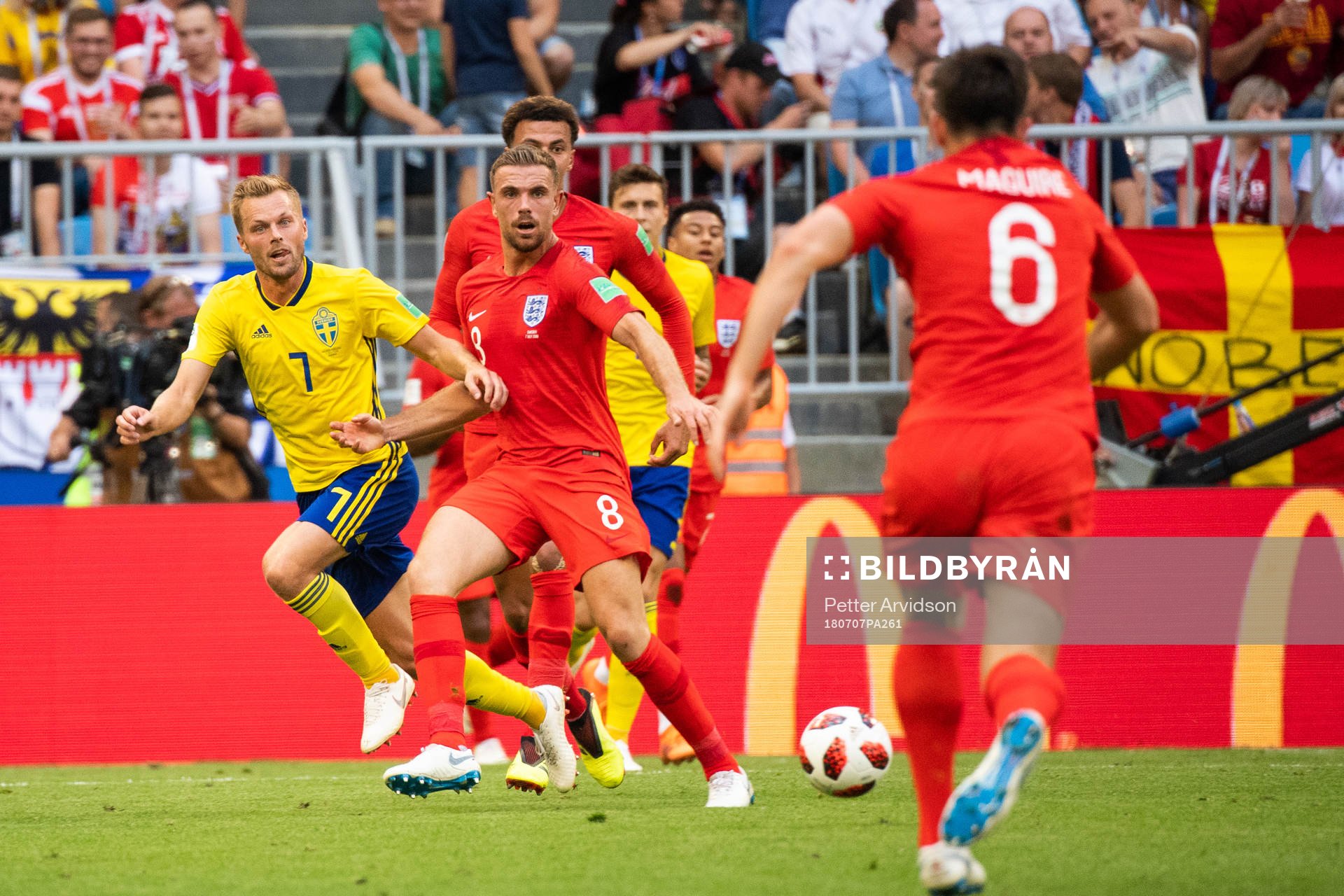 Sebastian Larsson of Sweden and Jordan Henderson of England
