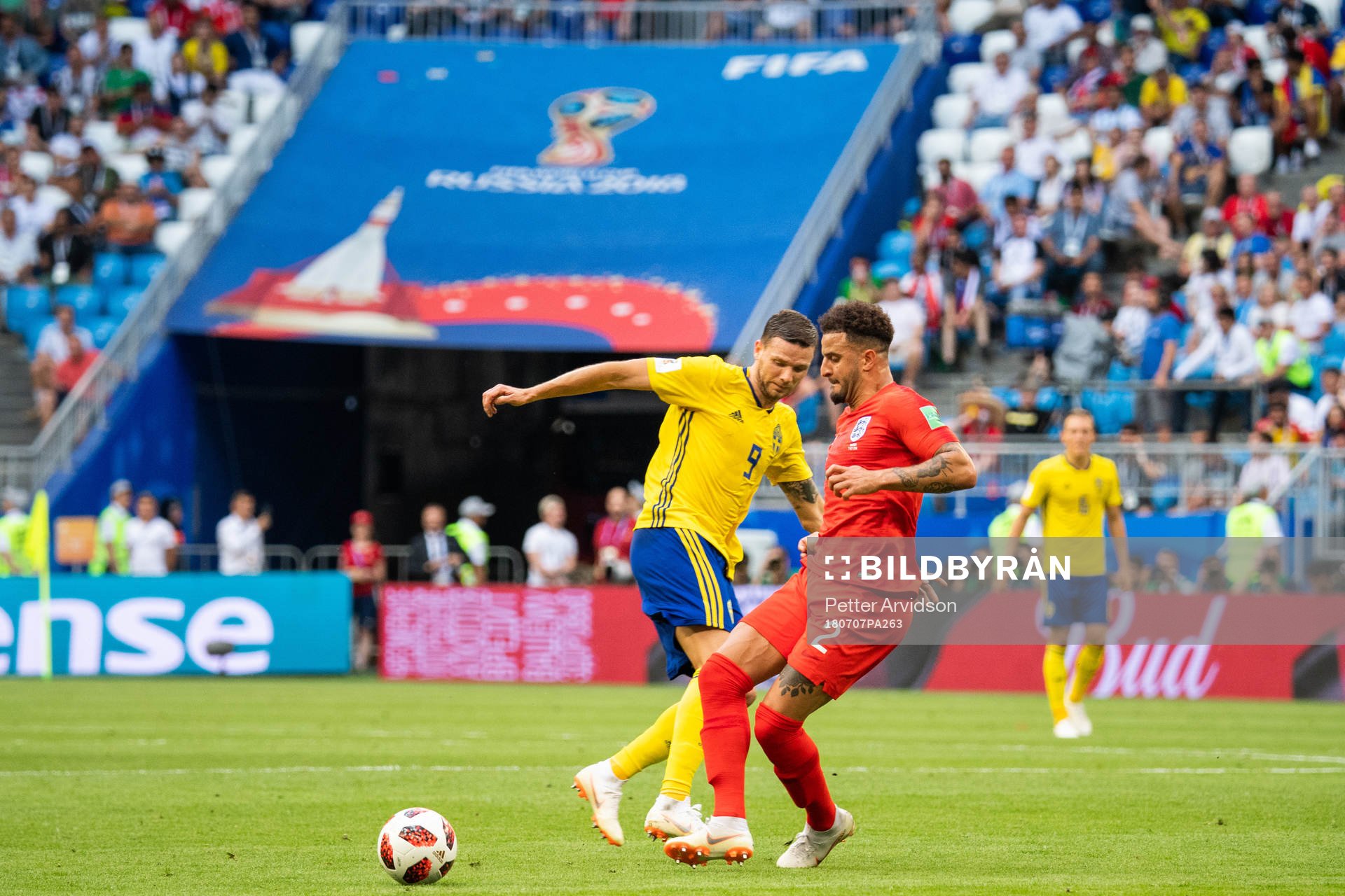Marcus Berg of Sweden and Kyle Walker of England competes