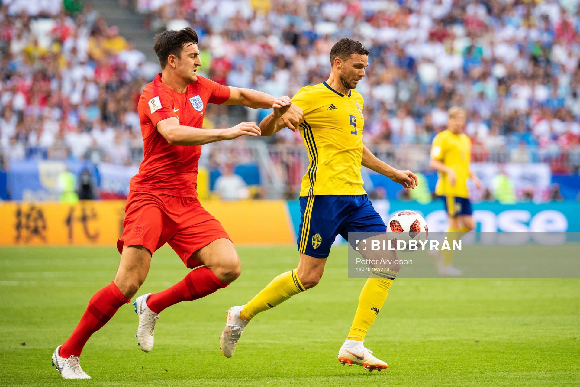 Harry Maguire of England and Marcus Berg of Sweden