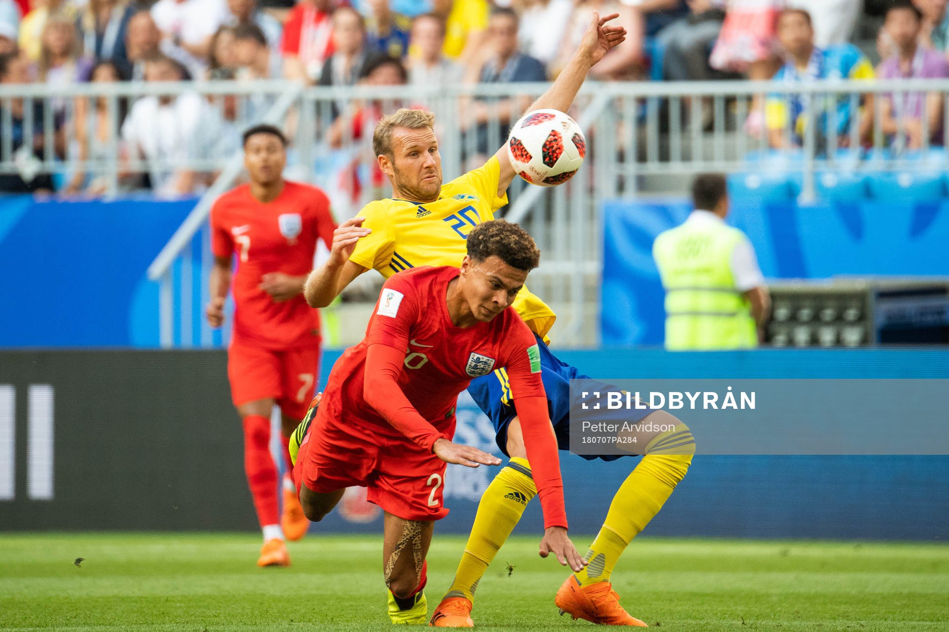 Dele Alli of England and Ola Toivonen of Sweden