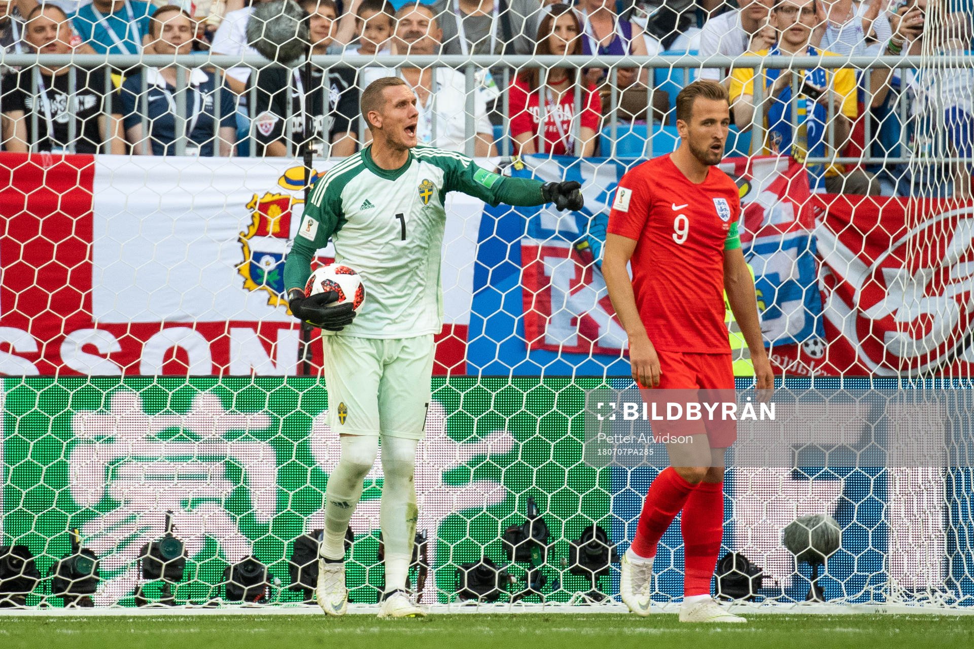 Goalkeeper Robin Olsen of Sweden and Harry Kane of England