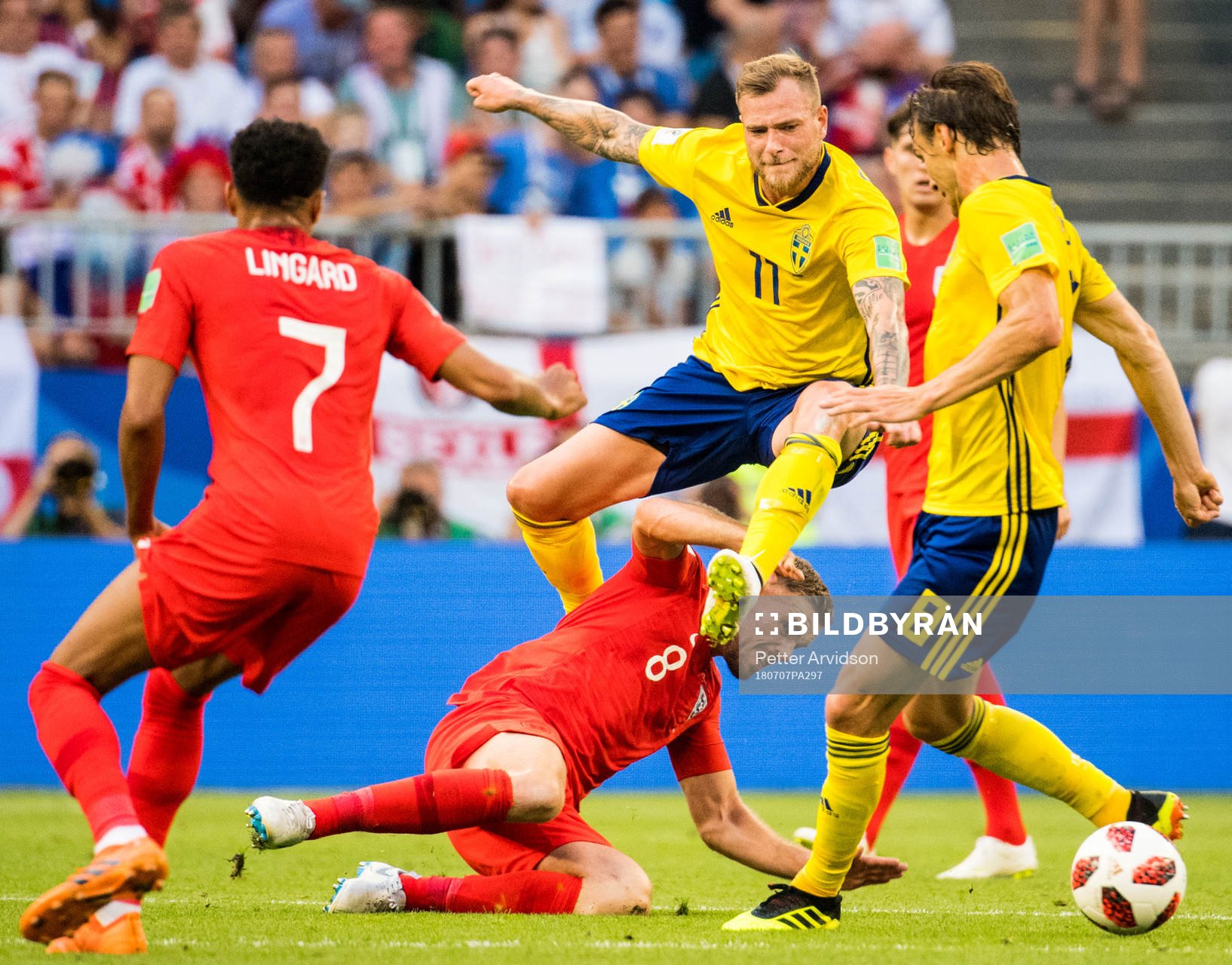 John Guidetti of Sweden and Jordan Henderson of England