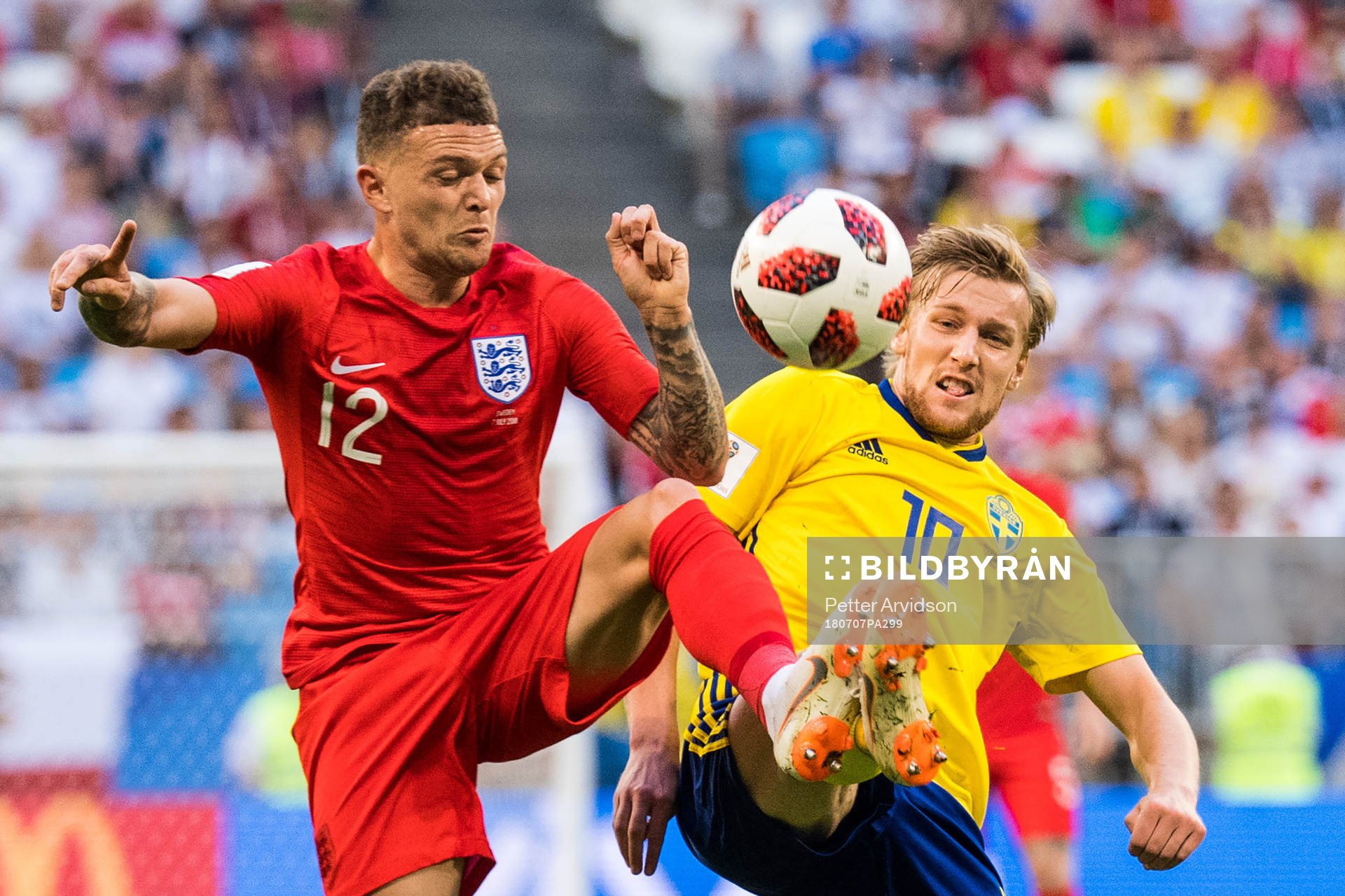 Kieran Trippier of England in action with Emil Forsberg of