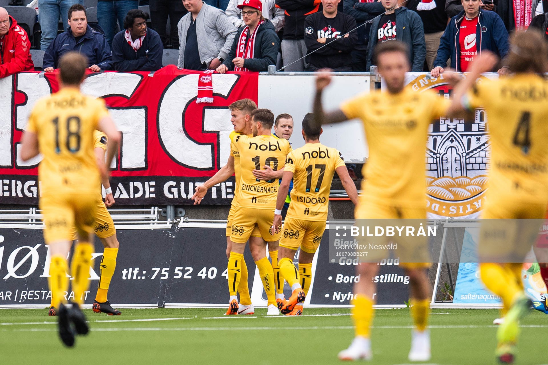 Kristian Fardal Opseth of Bodø/Glimt celebrates with team mates after scoring 1-1 during the Eliteserien match between Bodø/Glimt and Brann on July 8, 2018 in Bodø.