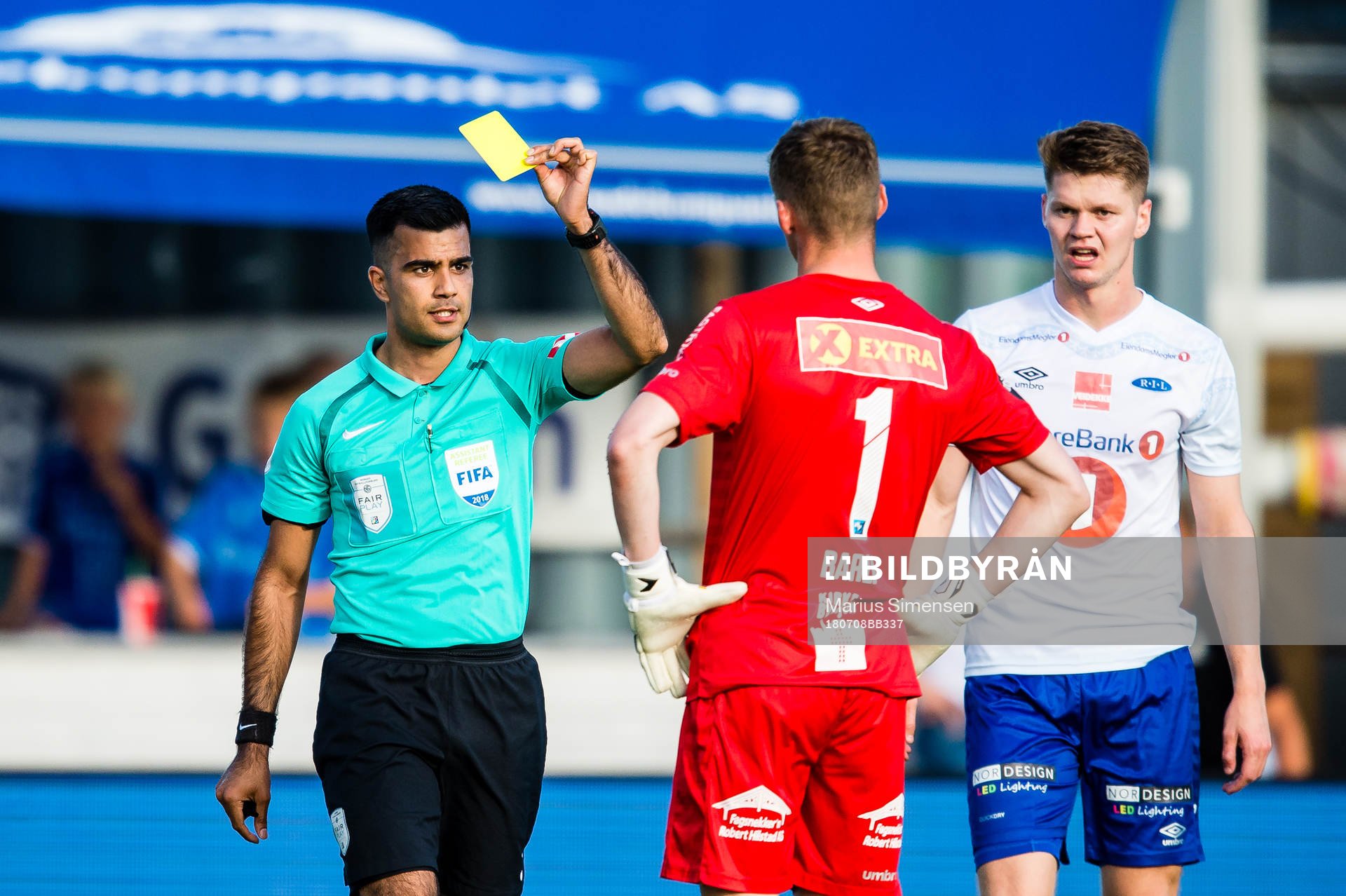 Rohit Saggi, referee, gives Even Barli of Ranheim a yelow
