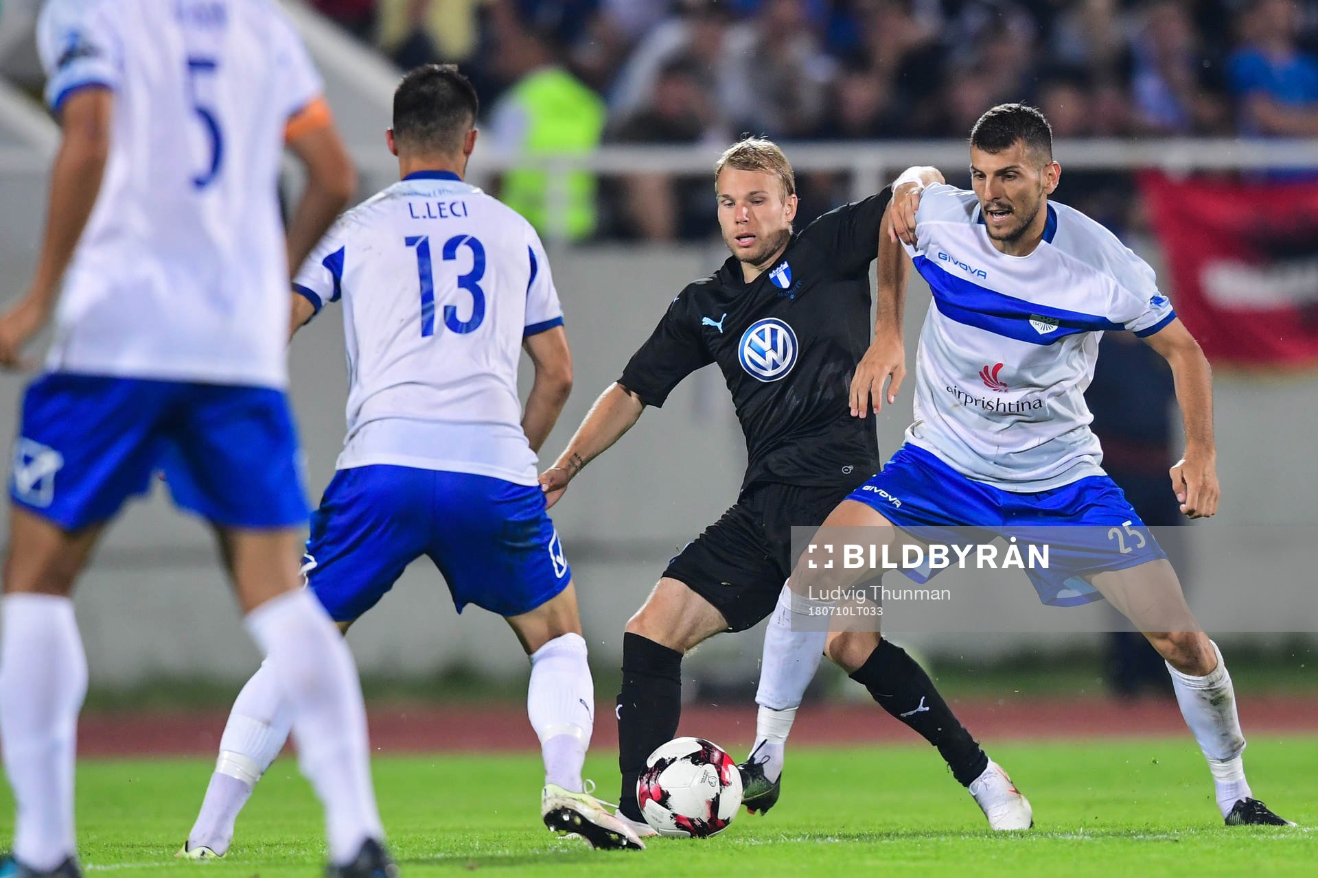 Oscar Lewicki of Malmö FF competes for the ball with Bujar