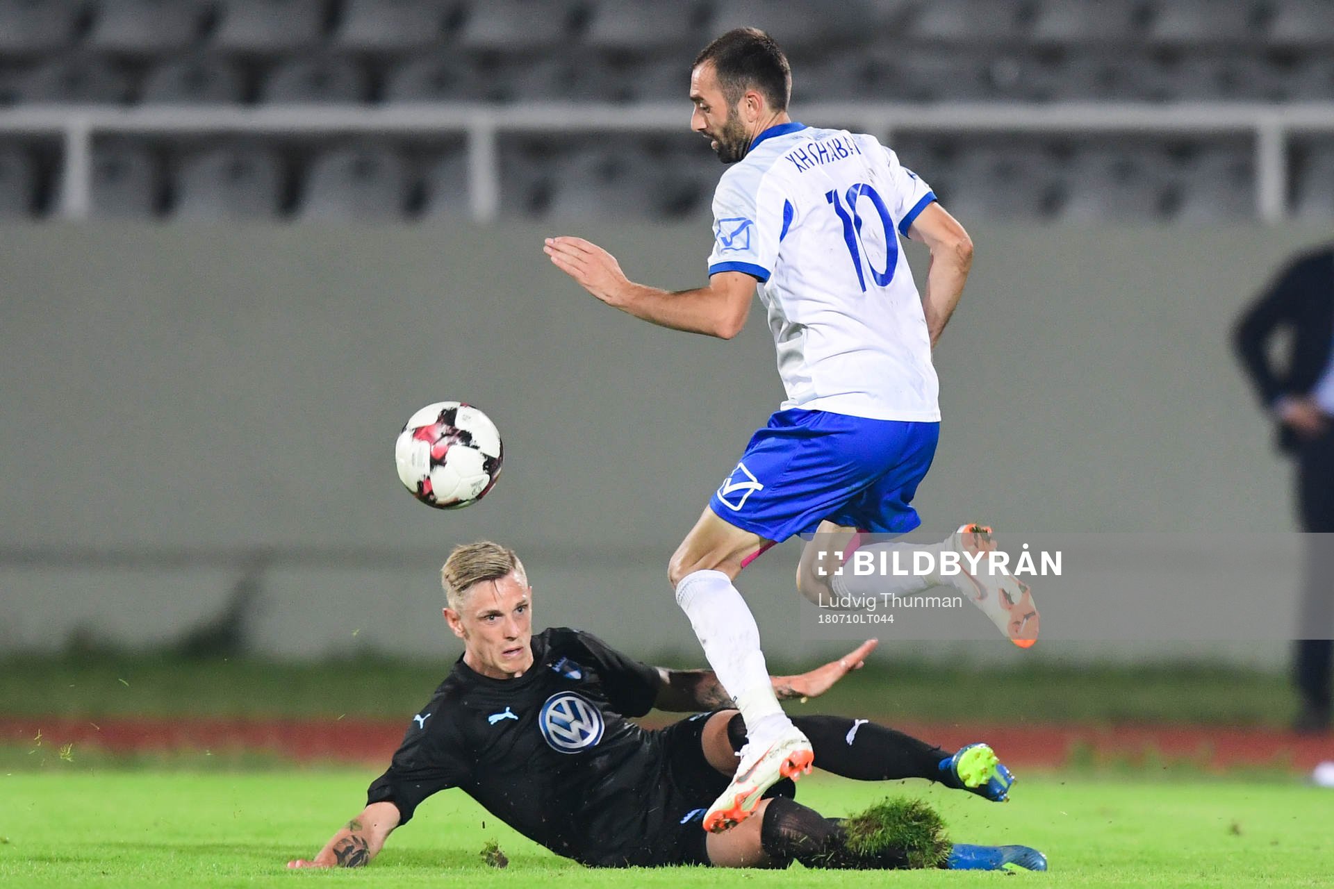 Sören Rieks of Malmö FF slide tackles Xhevdet Shabani of