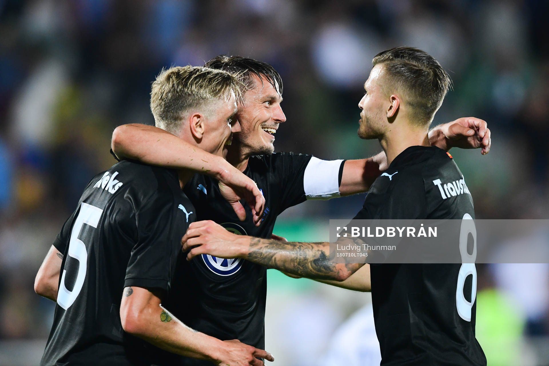 Sören Rieks celebrates with Markus Rosenberg and Arnór