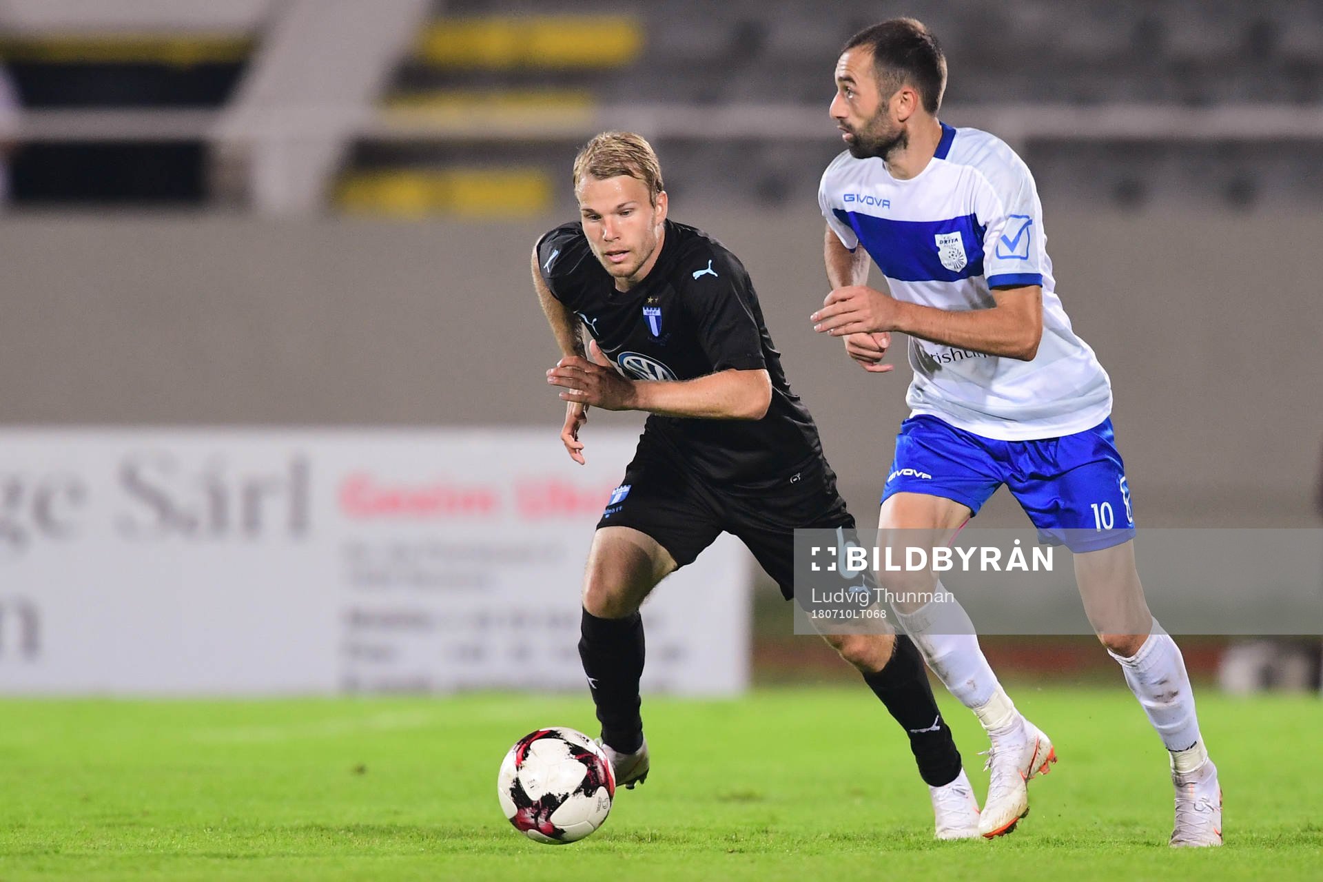 Oscar Lewicki  of Malmö FF and Xhevdet Shabani  of Drita