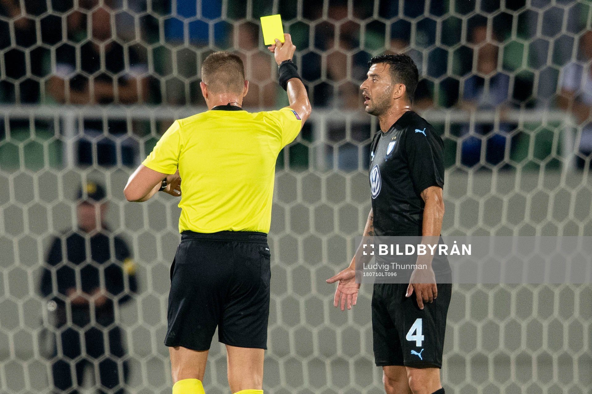 Behrang Safari of Malmö FF gets a yellow card