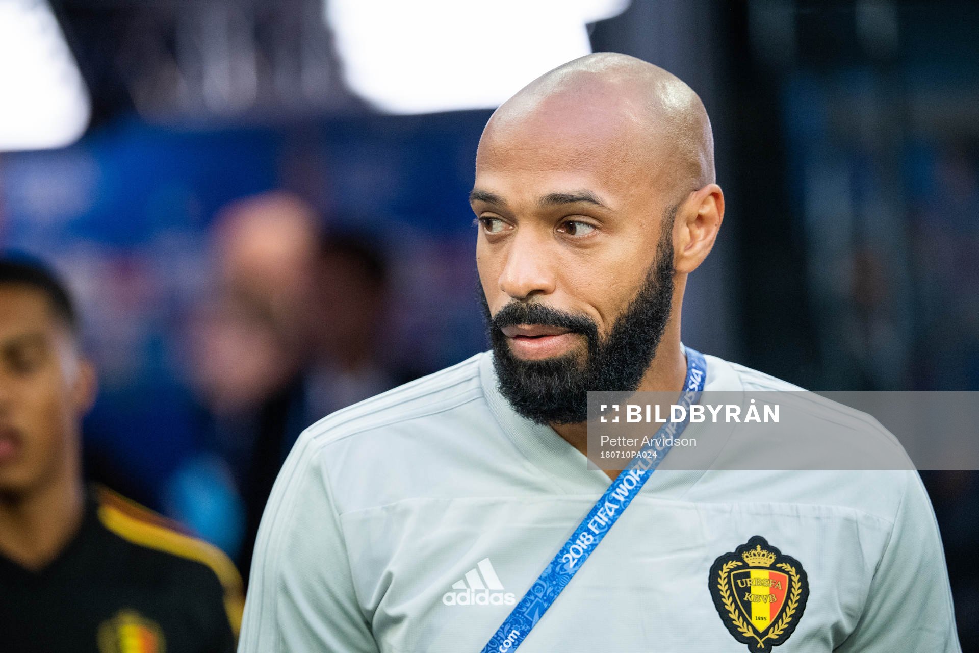 Assisting coach Thierry Henry of Belgium prior to the FIFA