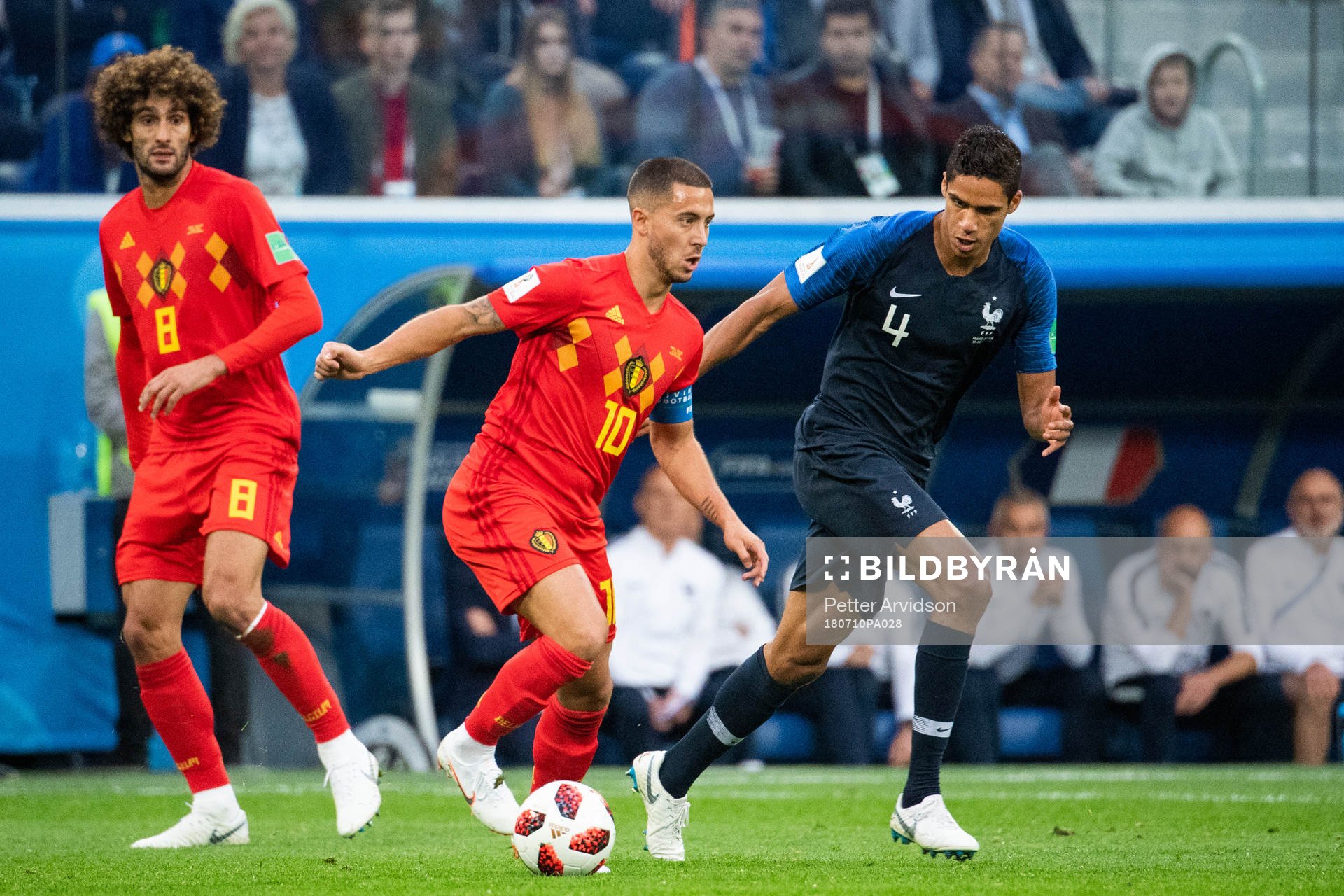 Marouane Fellaini and Eden Hazard of Belgium competes for
