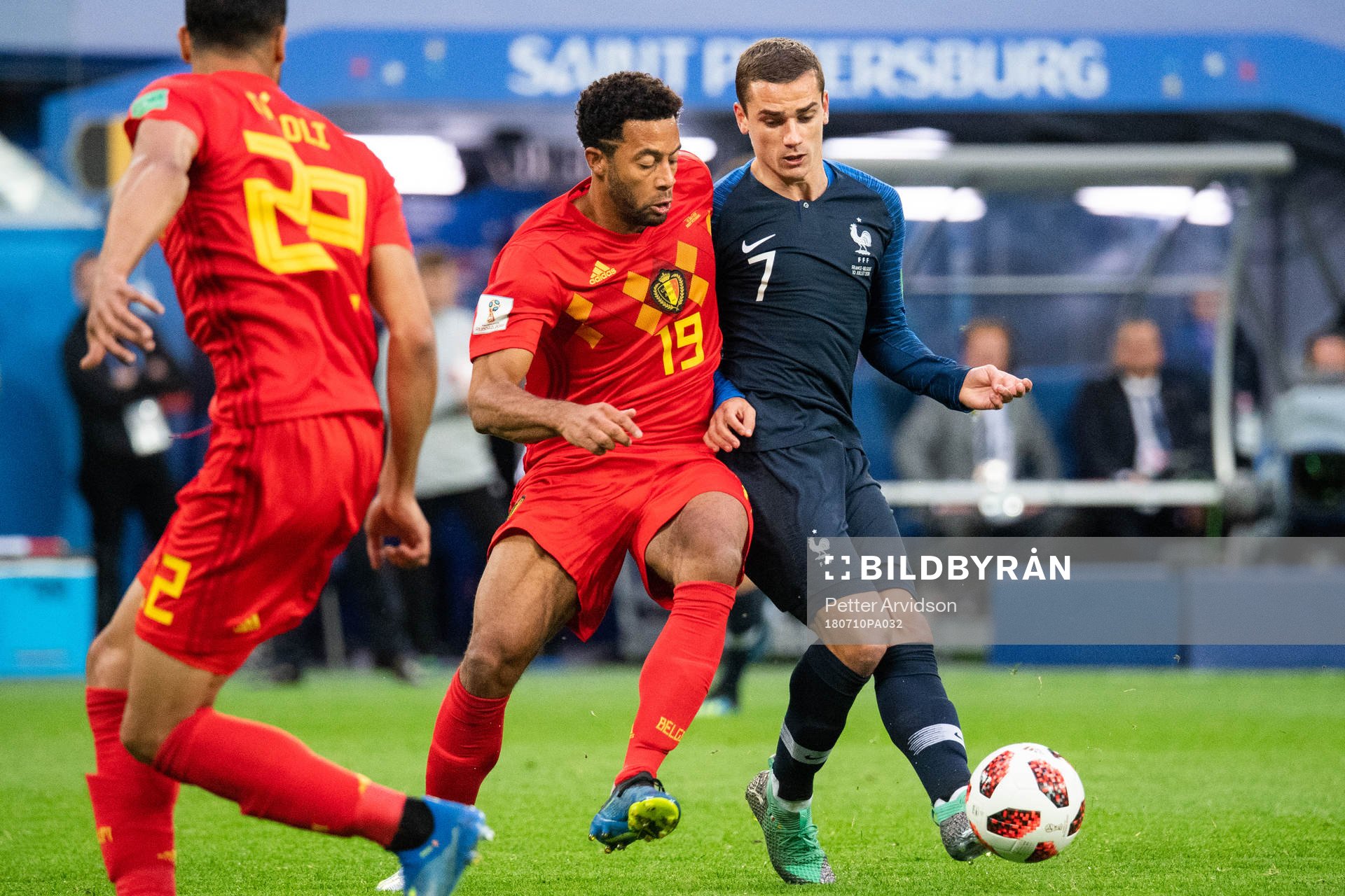 Moussa Dembele of Belgium competes for the ball with