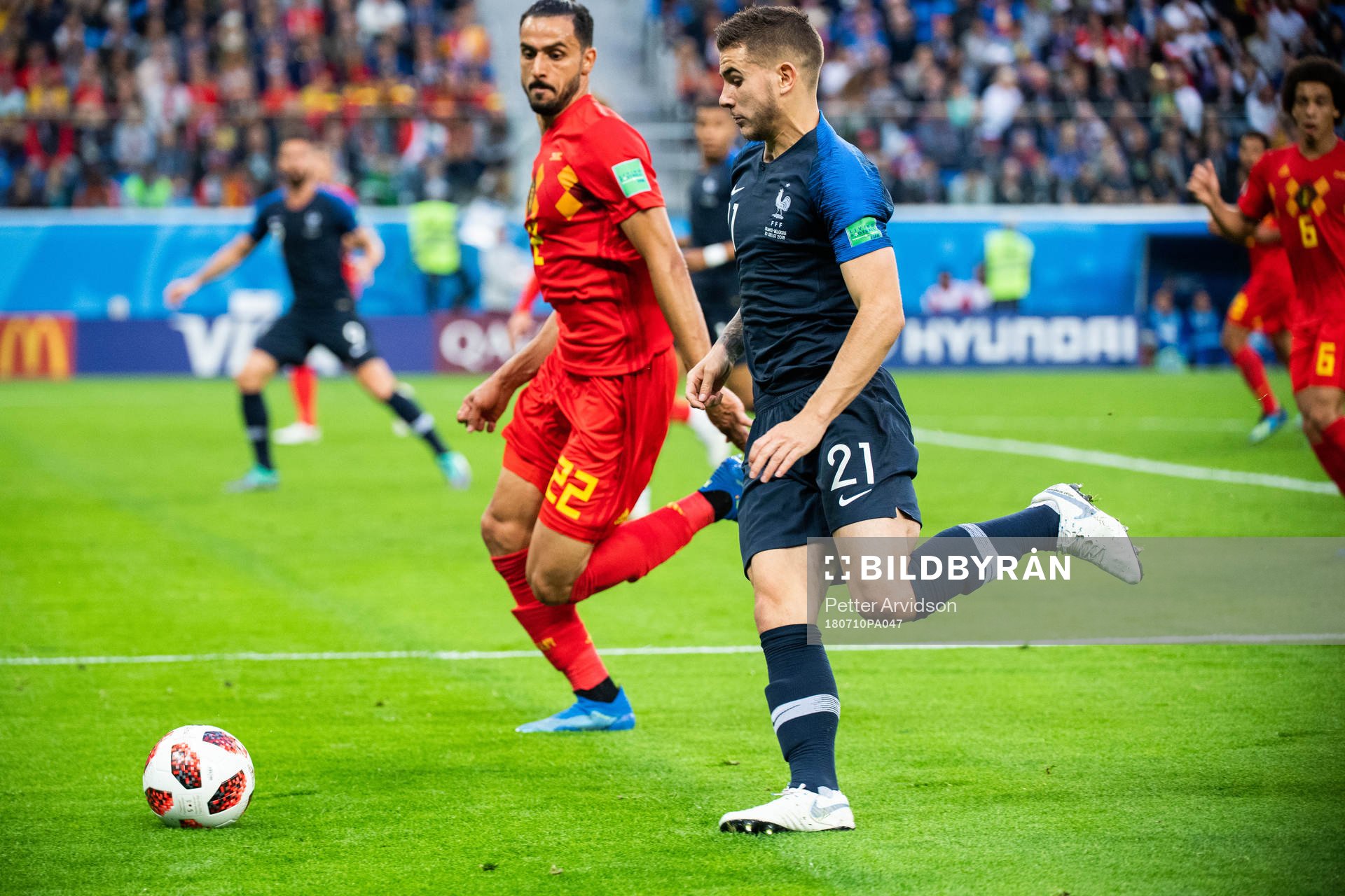 Lucas Hernandez of France and Nacer Chadli of Belgium