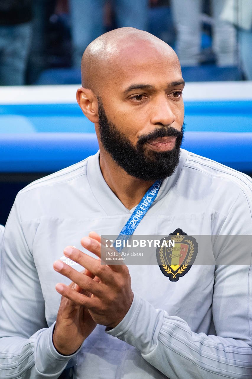 Assisting coach Thierry Henry of Belgium prior to the FIFA