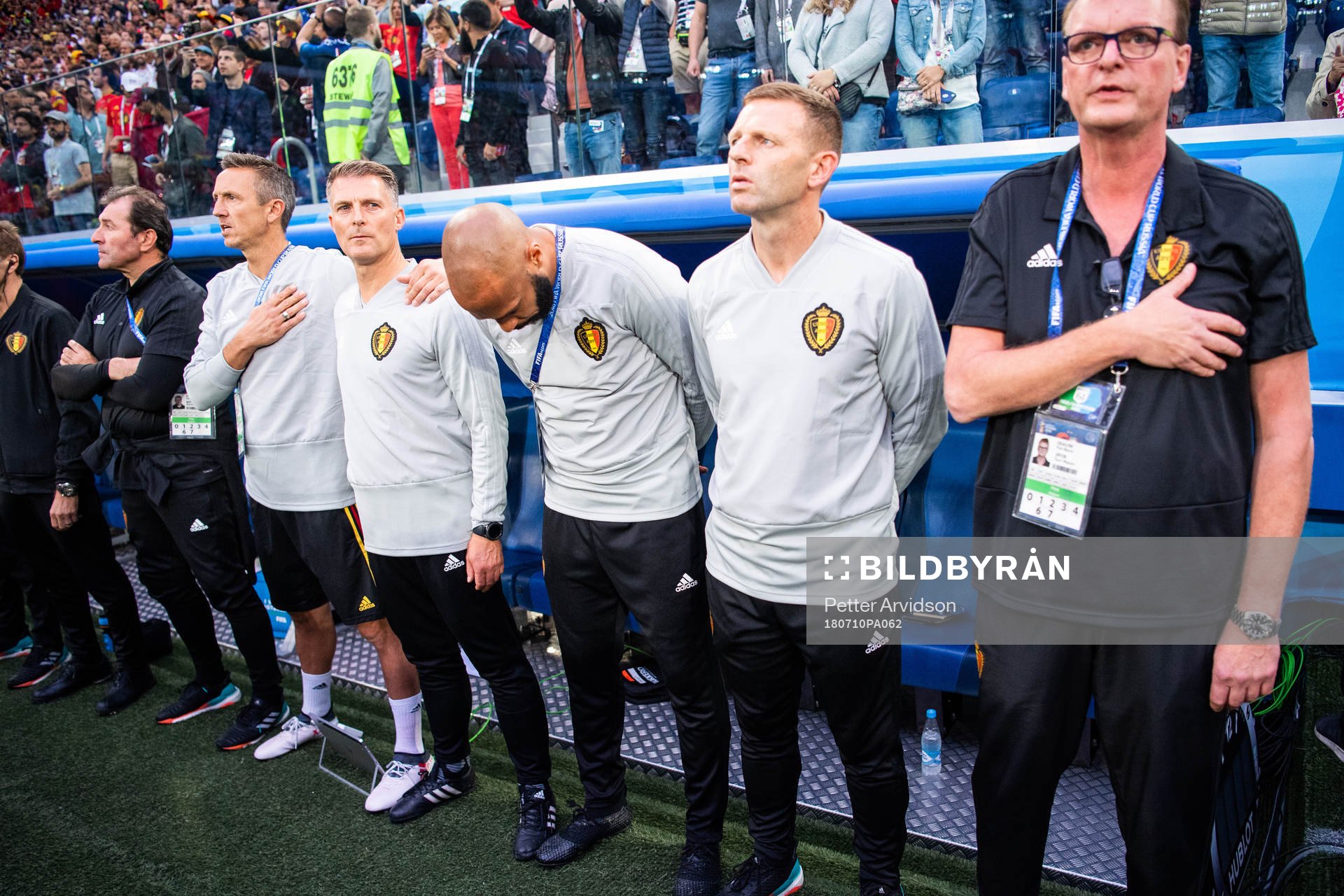 Assisting coach Thierry Henry (bows) of Belgium prior to